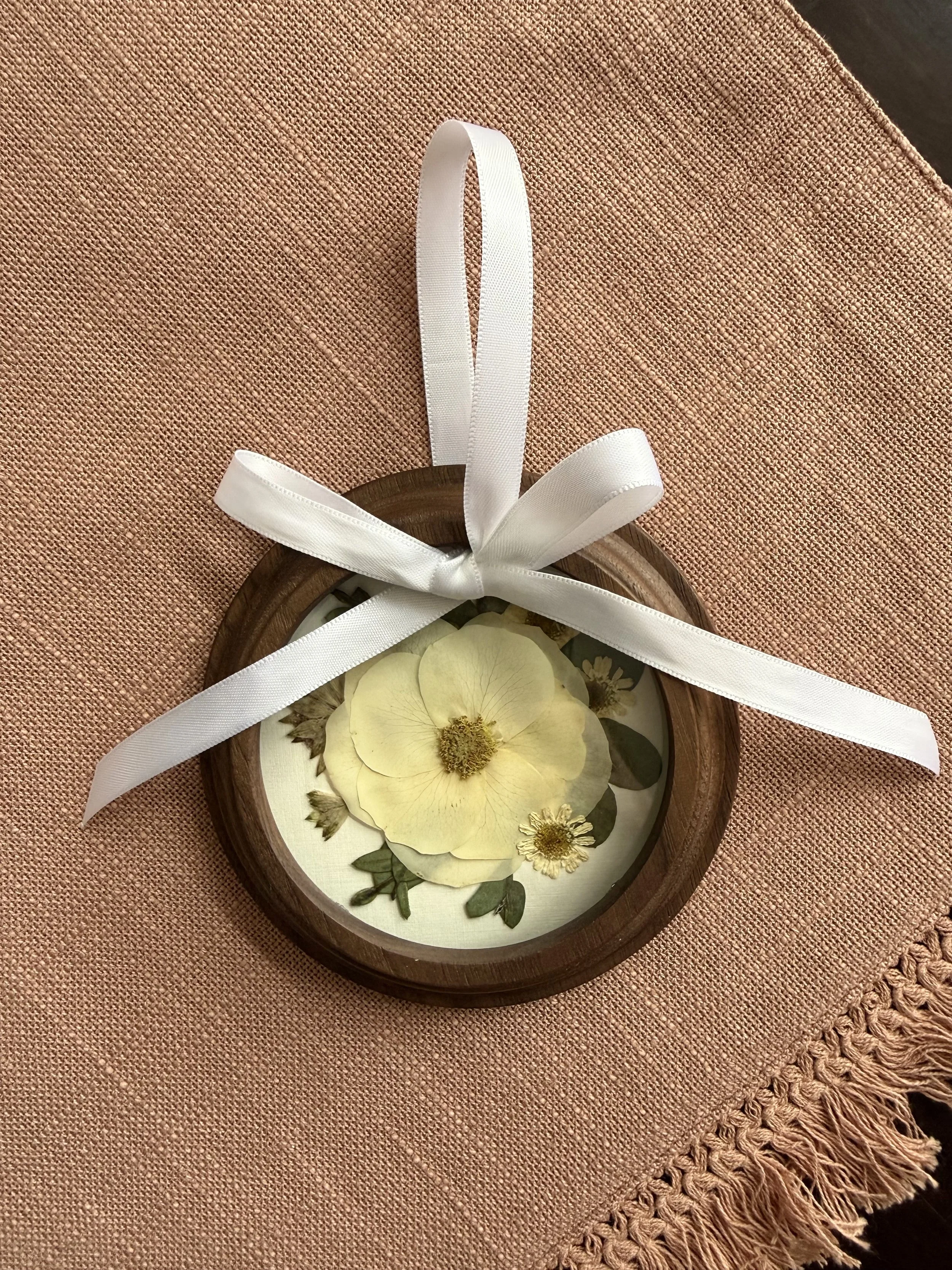 Wood pressed flower ornament.