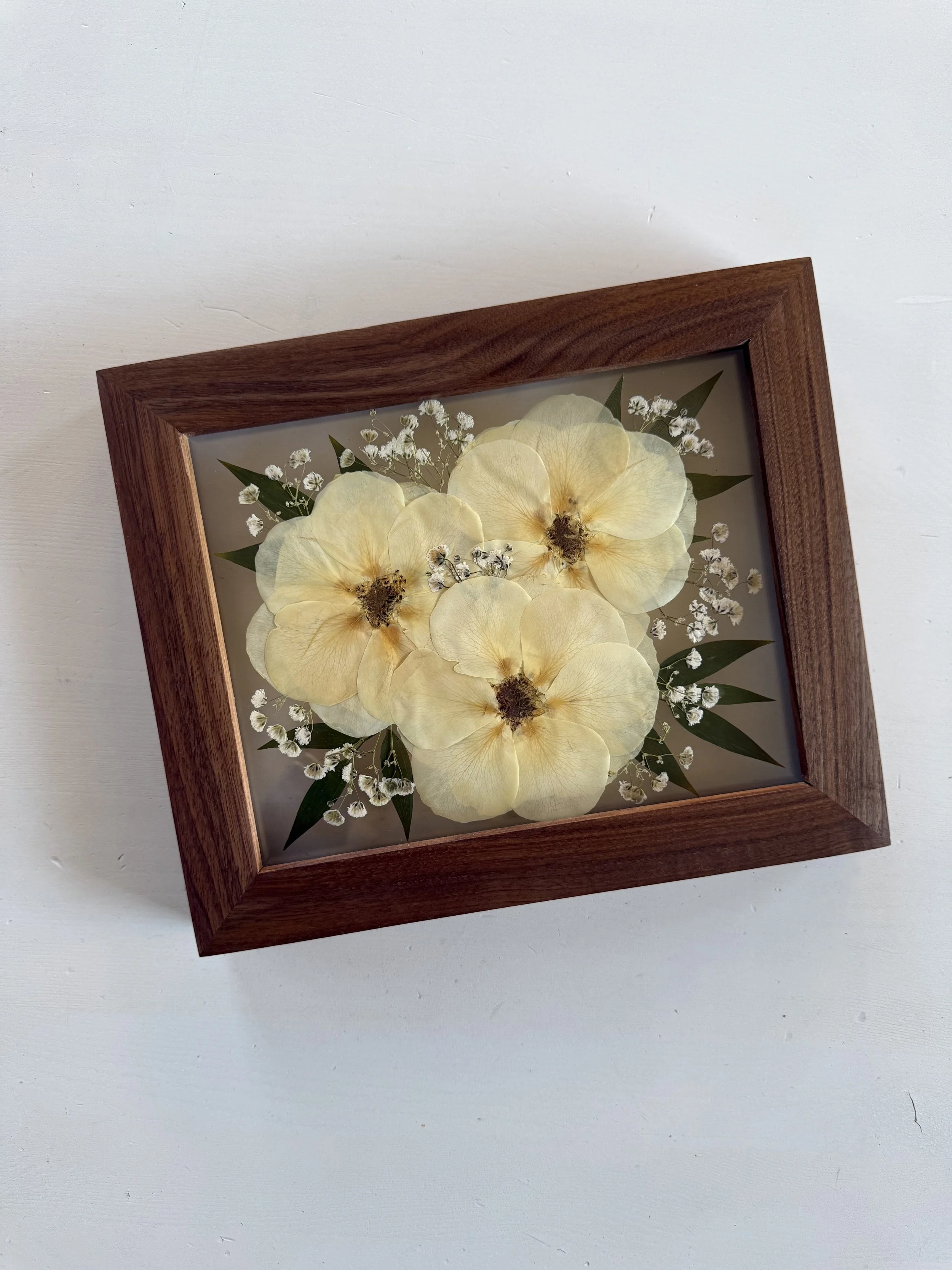 White rose bridal bouquet flowers, pressed and framed in a bouquet design.