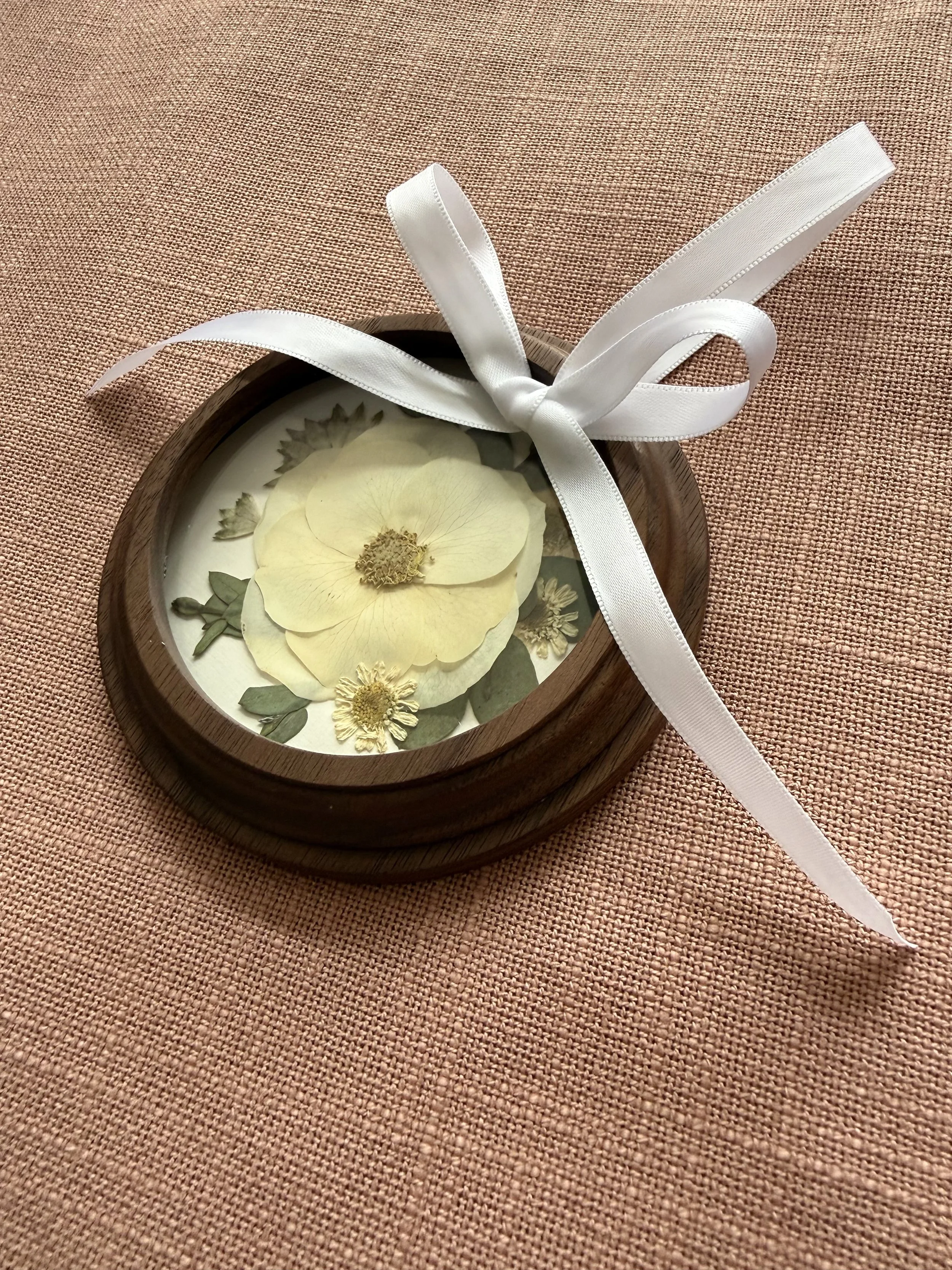 Wood pressed flower ornament.