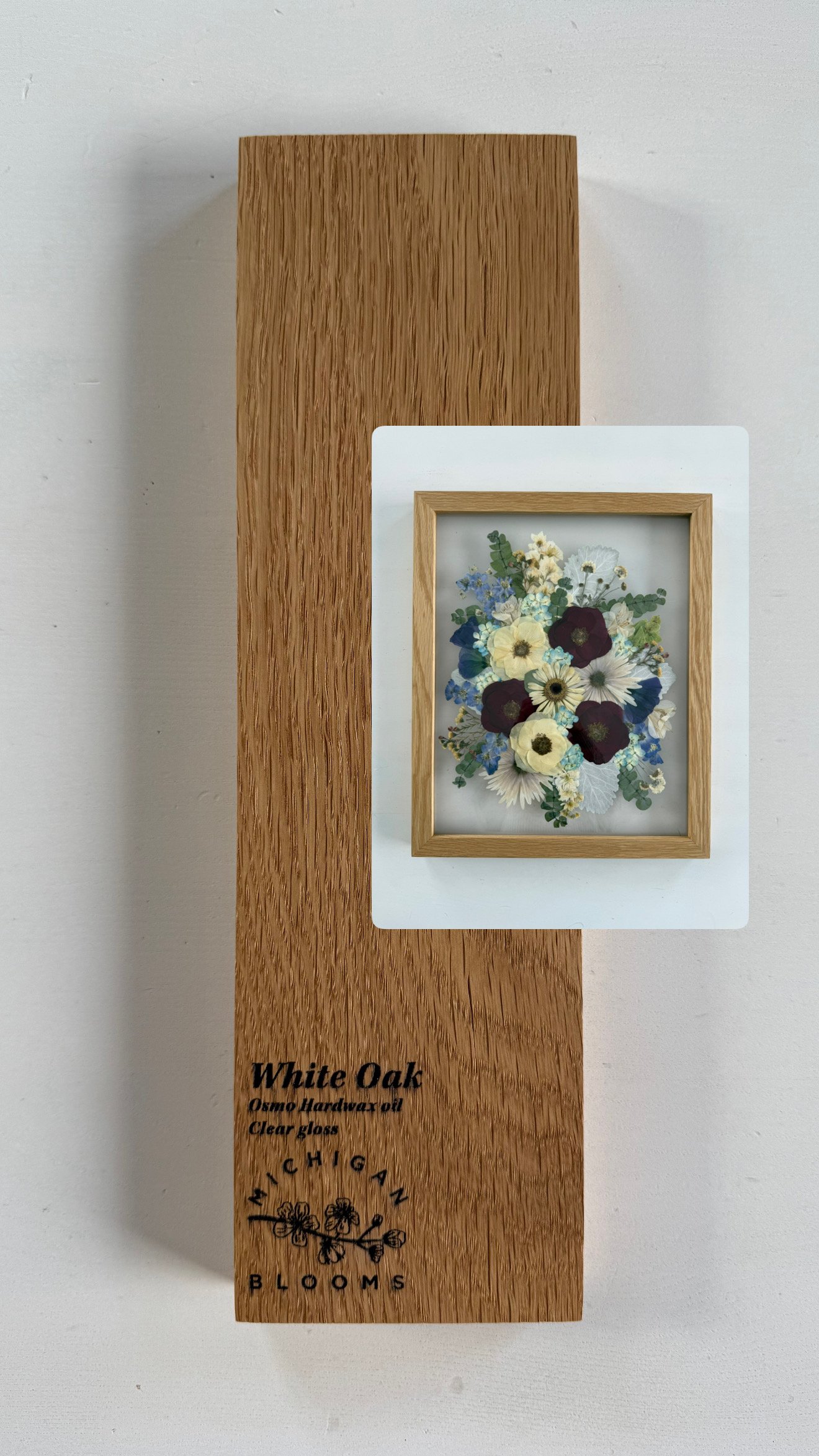 white oak frame with pressed flowers.