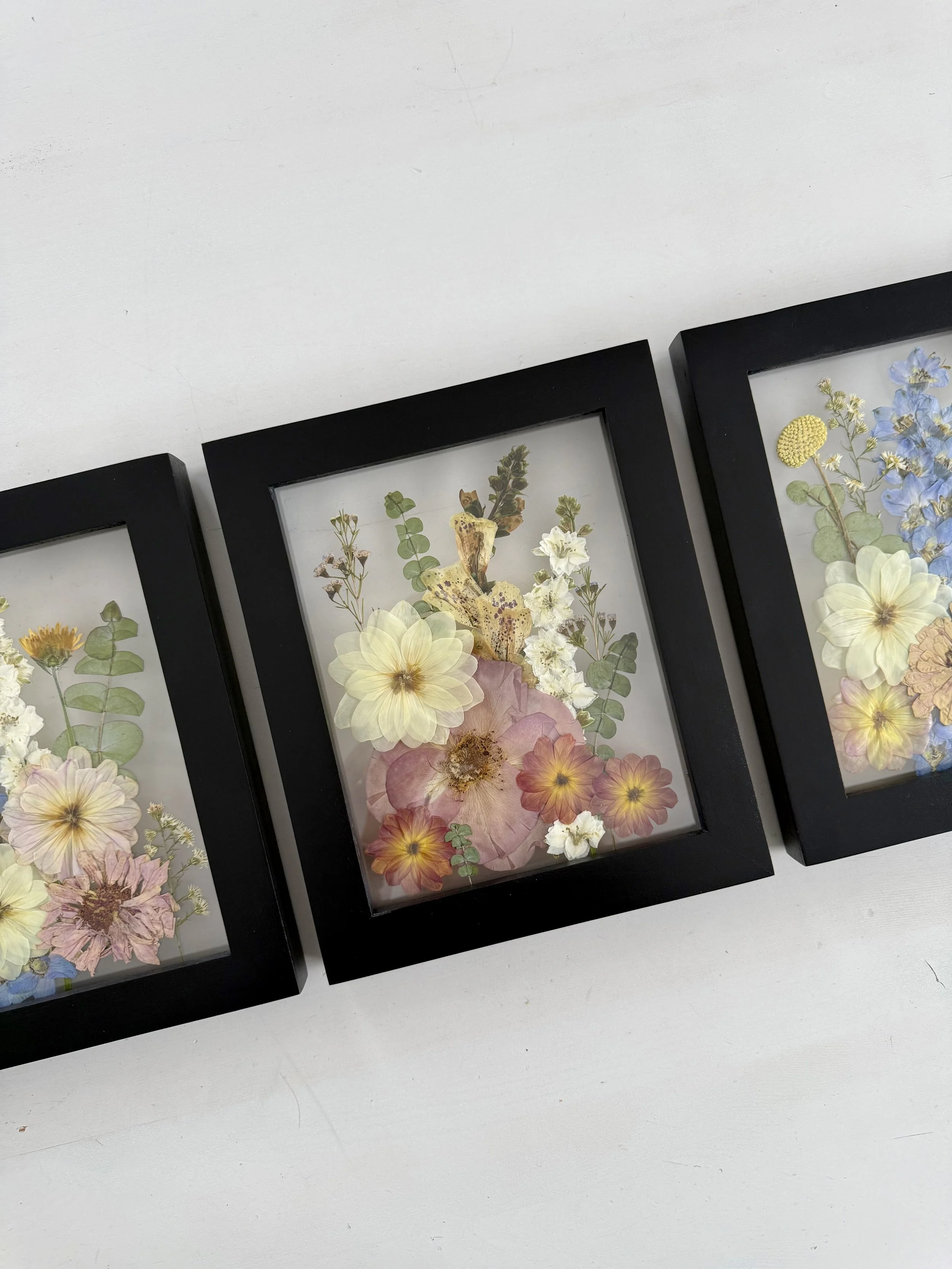 Bridal bouquet pressed and preserved, gallery wall set framed.