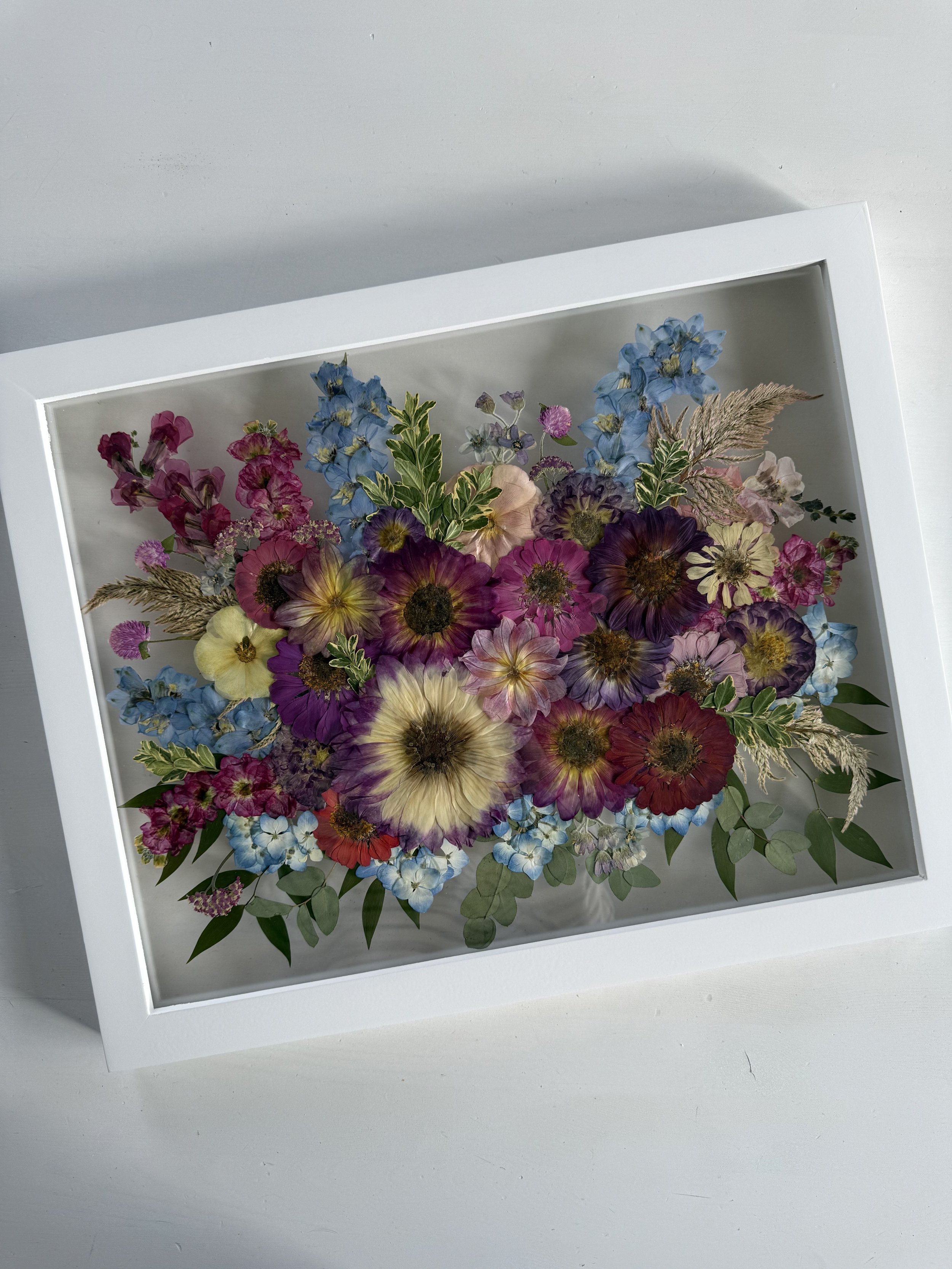 Dahlia and summer bridal bouquet flowers, pressed and framed in a bouquet design.