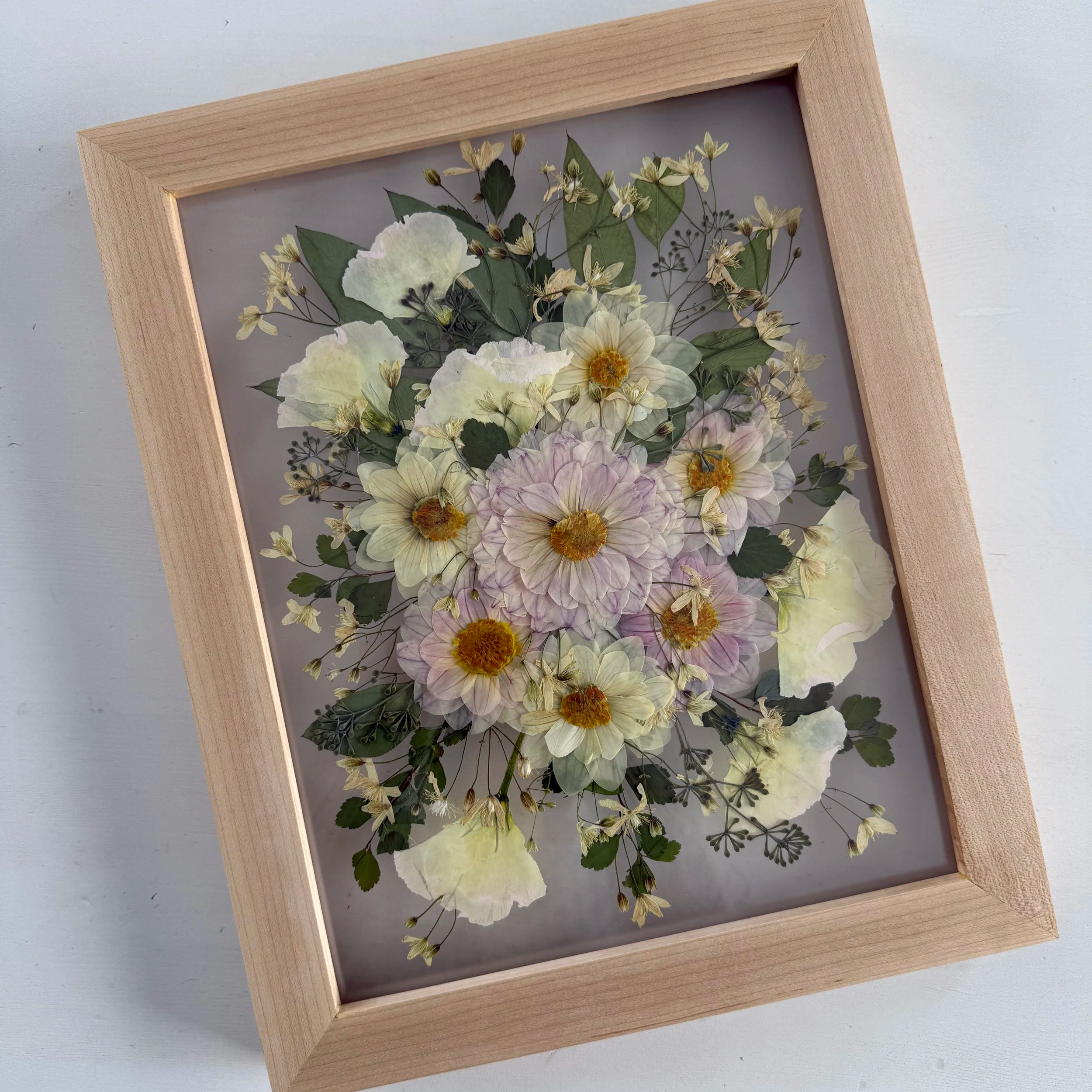 Framed and preserved bridal bouquet.