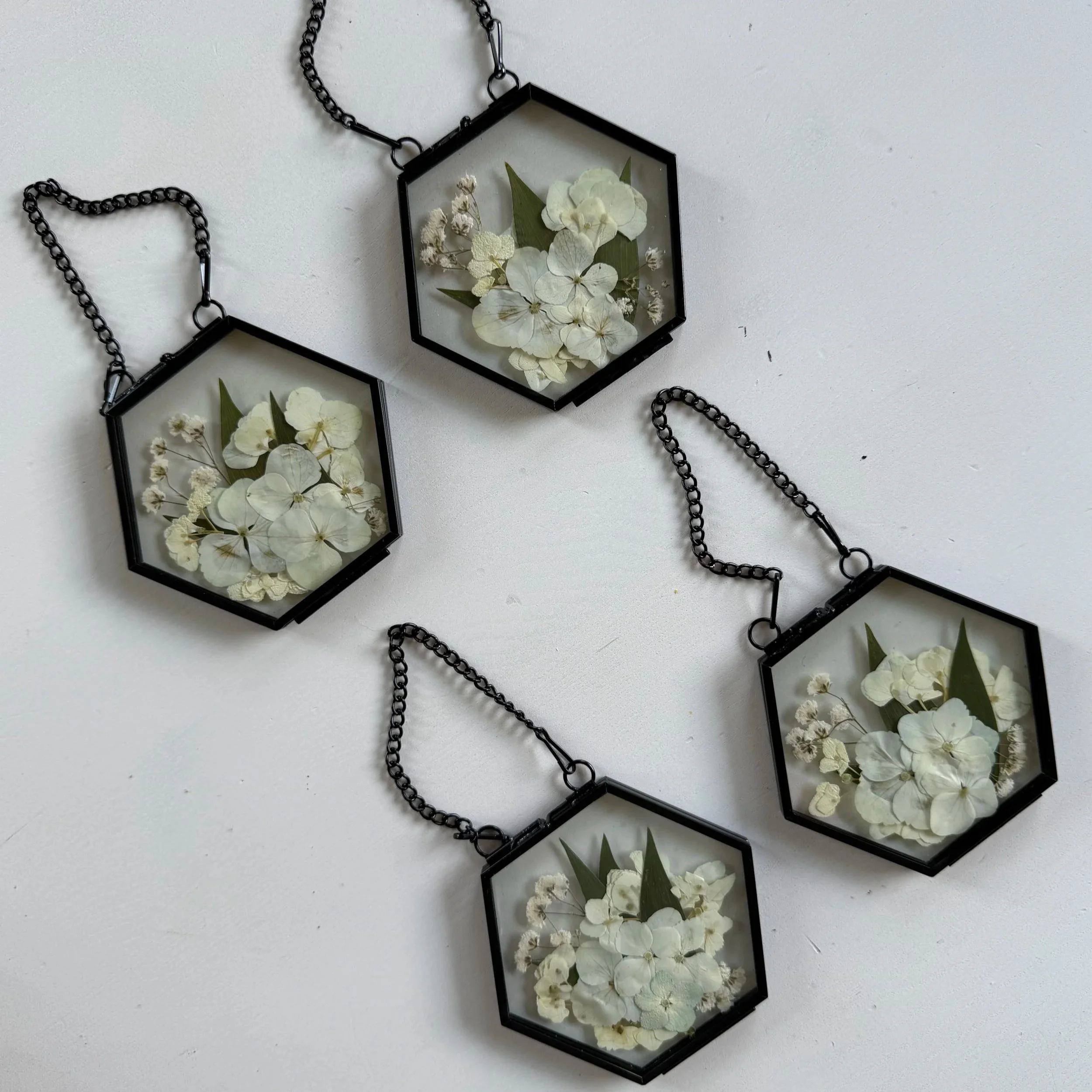 Pressed flower bridal ornament.