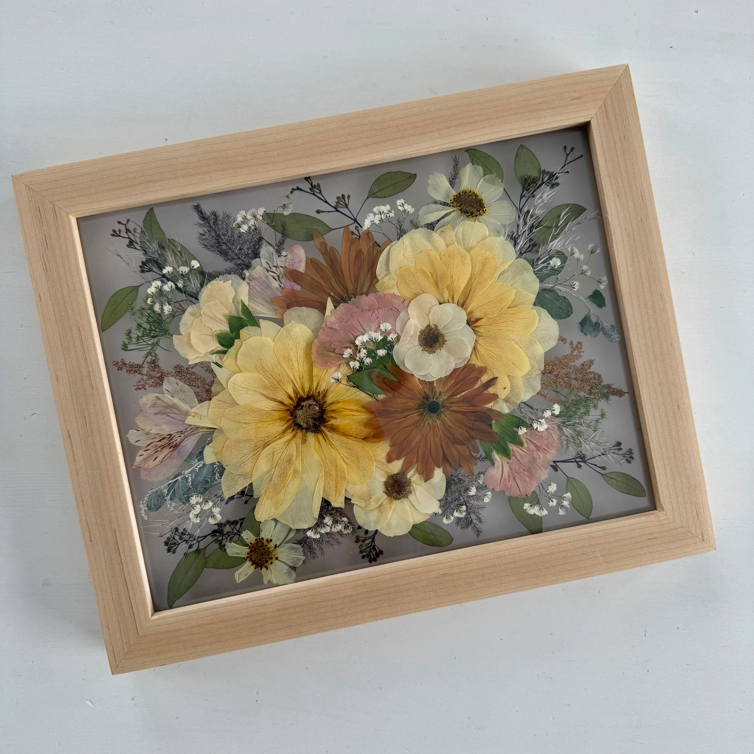 Framed and preserved wedding bouquet.