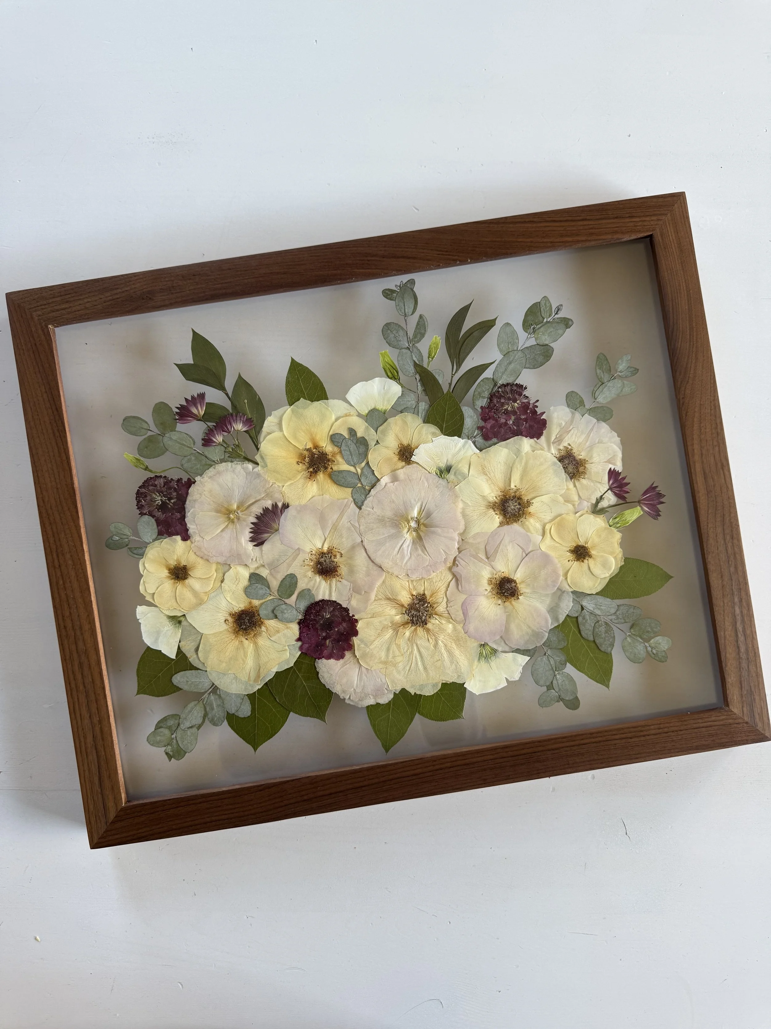 Framed and preserved muted tone bridal bouquet in 16x20 inch size.