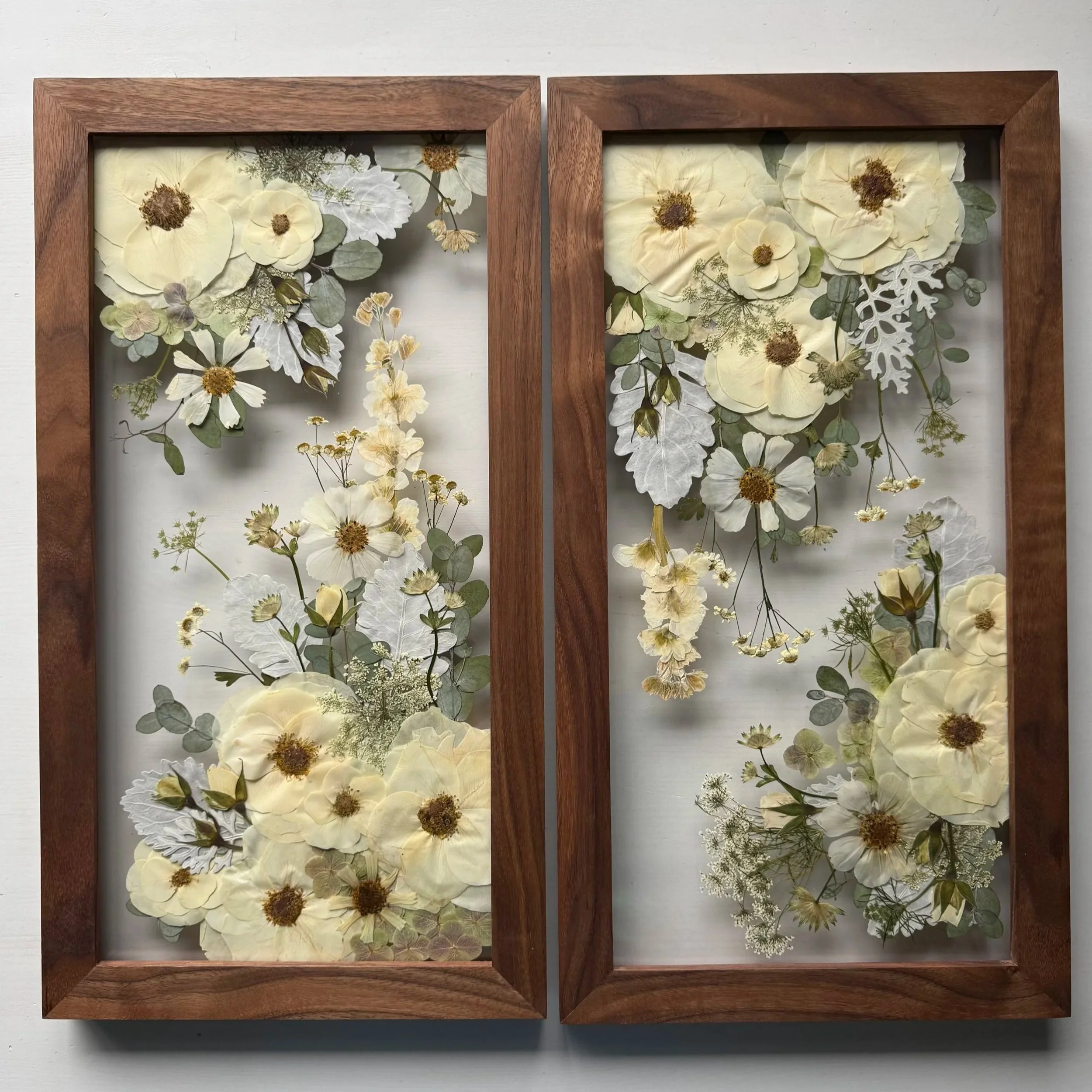 A pressed flower gallery set of 3 coordinating frames.