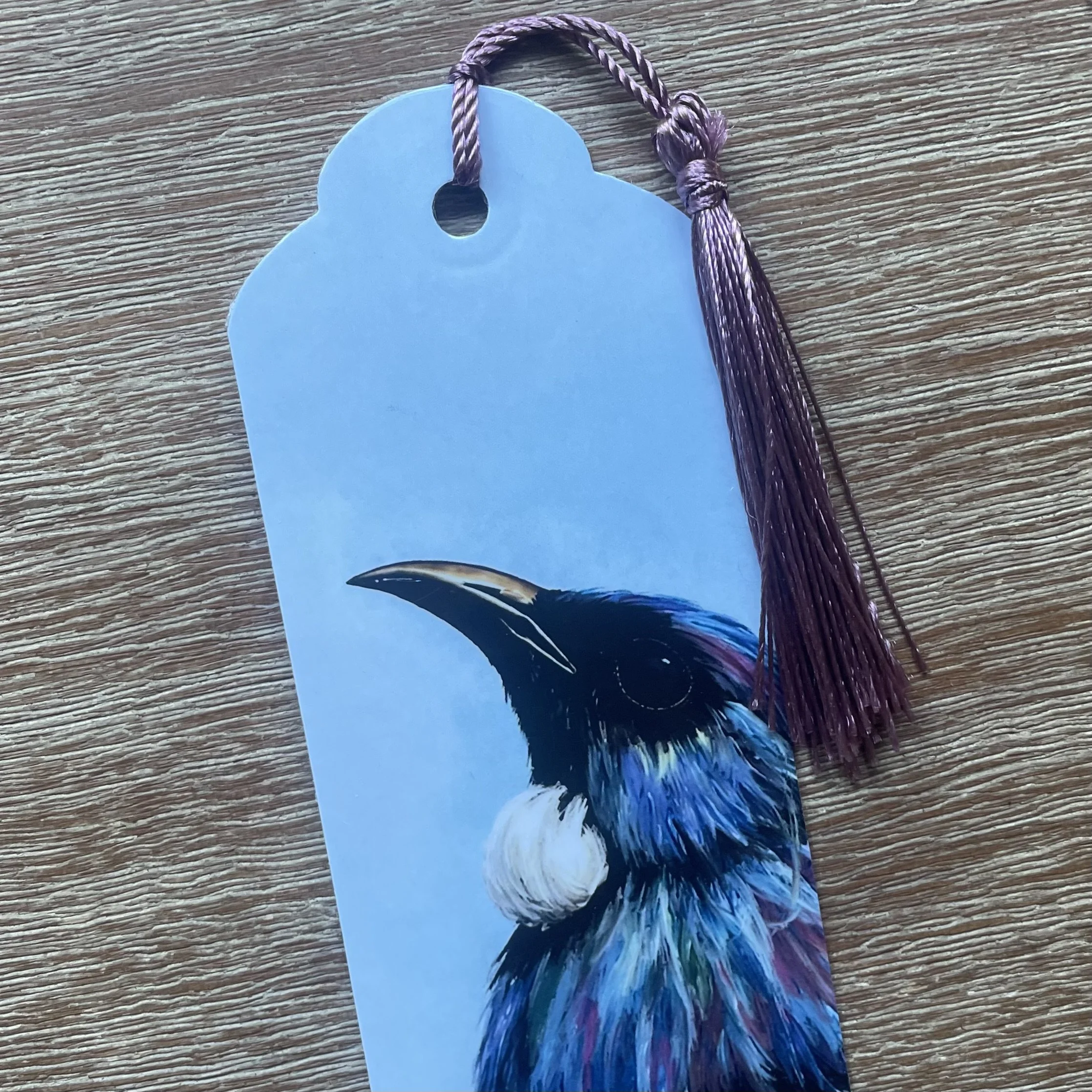 Handmade laminated New Zealand native bird bookmark with tassel designed in Picton Marlborough Sounds