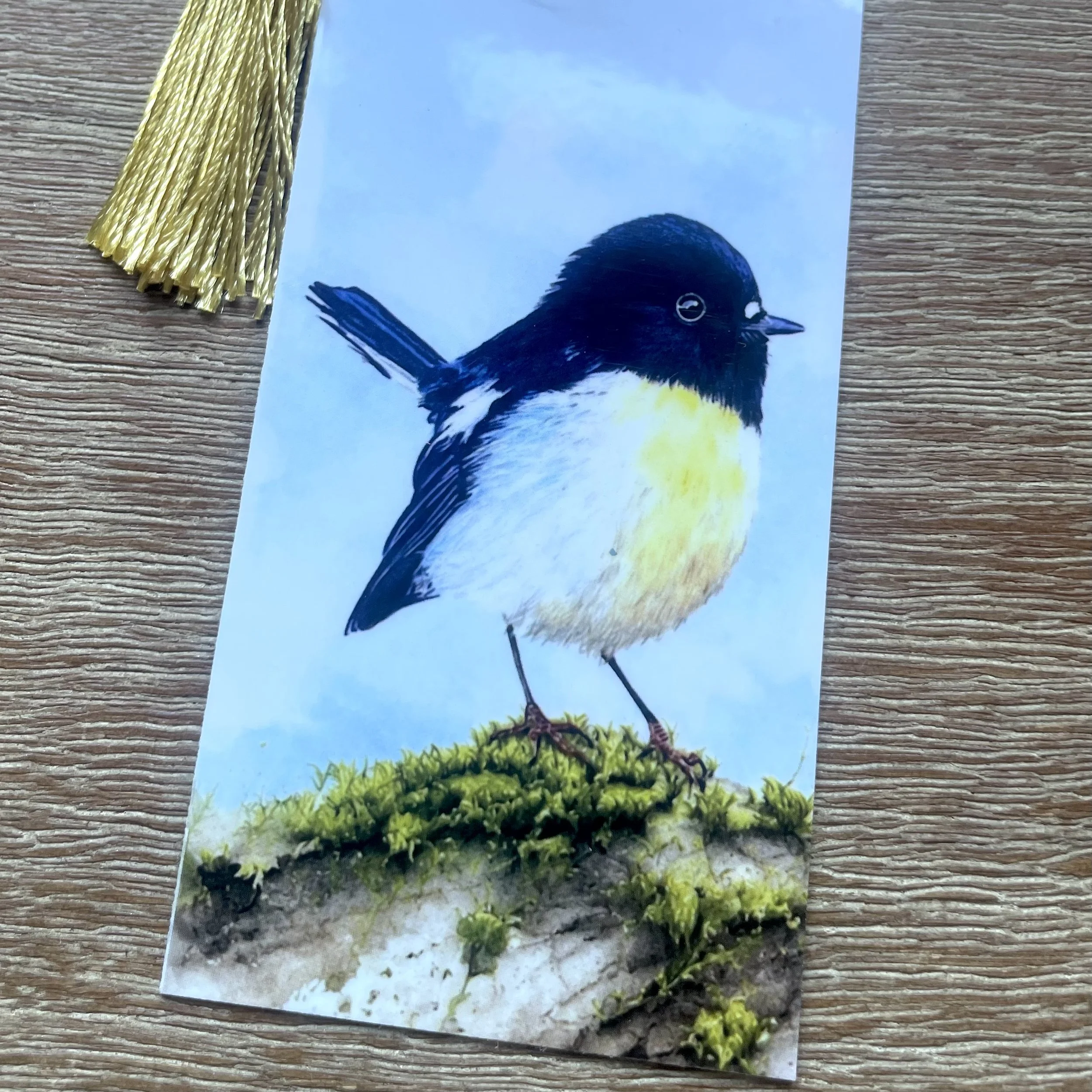 Handmade laminated New Zealand native bird bookmark with tassel designed in Picton Marlborough Sounds