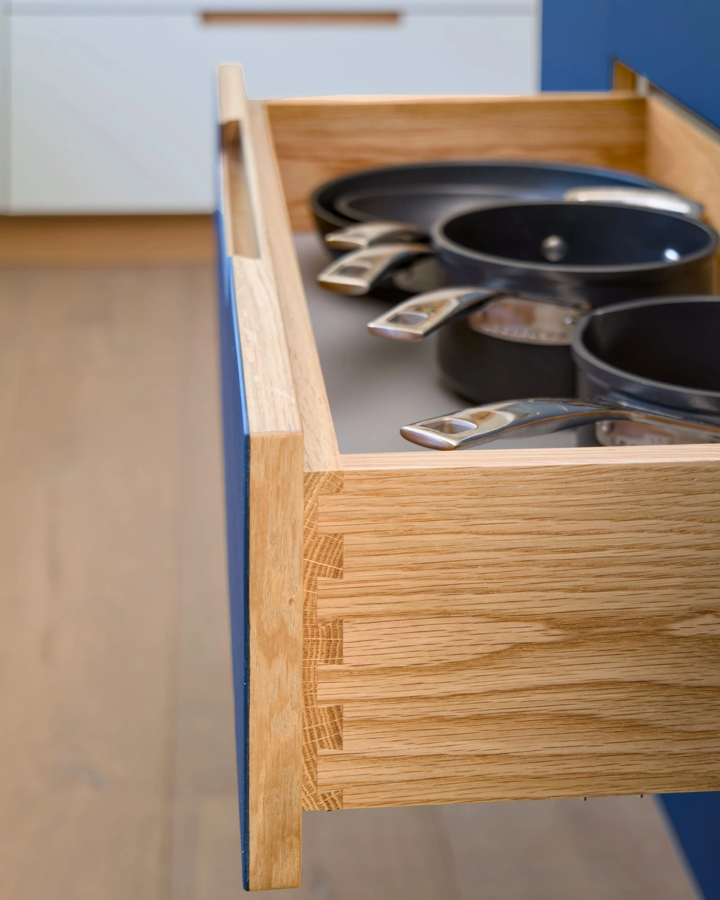 Open kitchen drawer showing dovetailed American white oak drawer box construction
