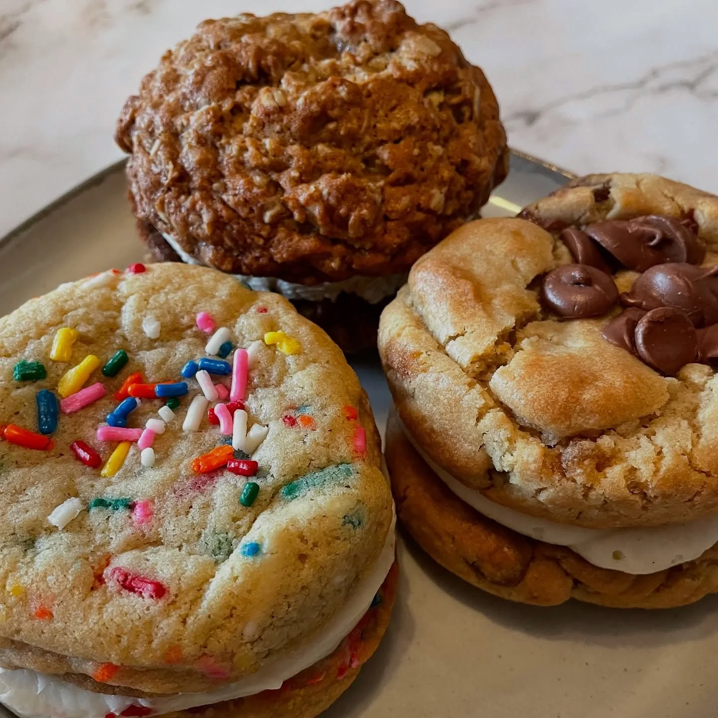 ✨GIVEAWAY CLOSED✨ 
As a thank you for an amazing summer season and before we head into my favorite time of year (with new menu items!), I&rsquo;m hosting a giveaway! 

To win this cookie sandwich trio (featuring funfetti, chocolate chip, and oatmeal)