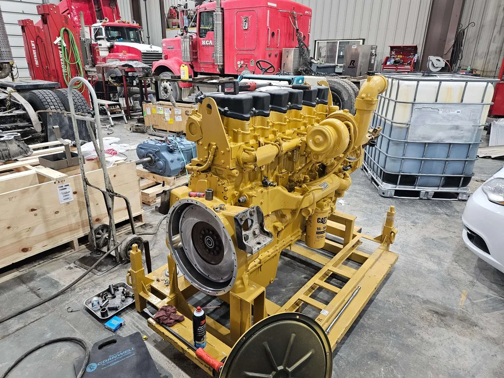 Industrial diesel engine out on a stand for a rebuild at Itty Bitty Equipment Co.