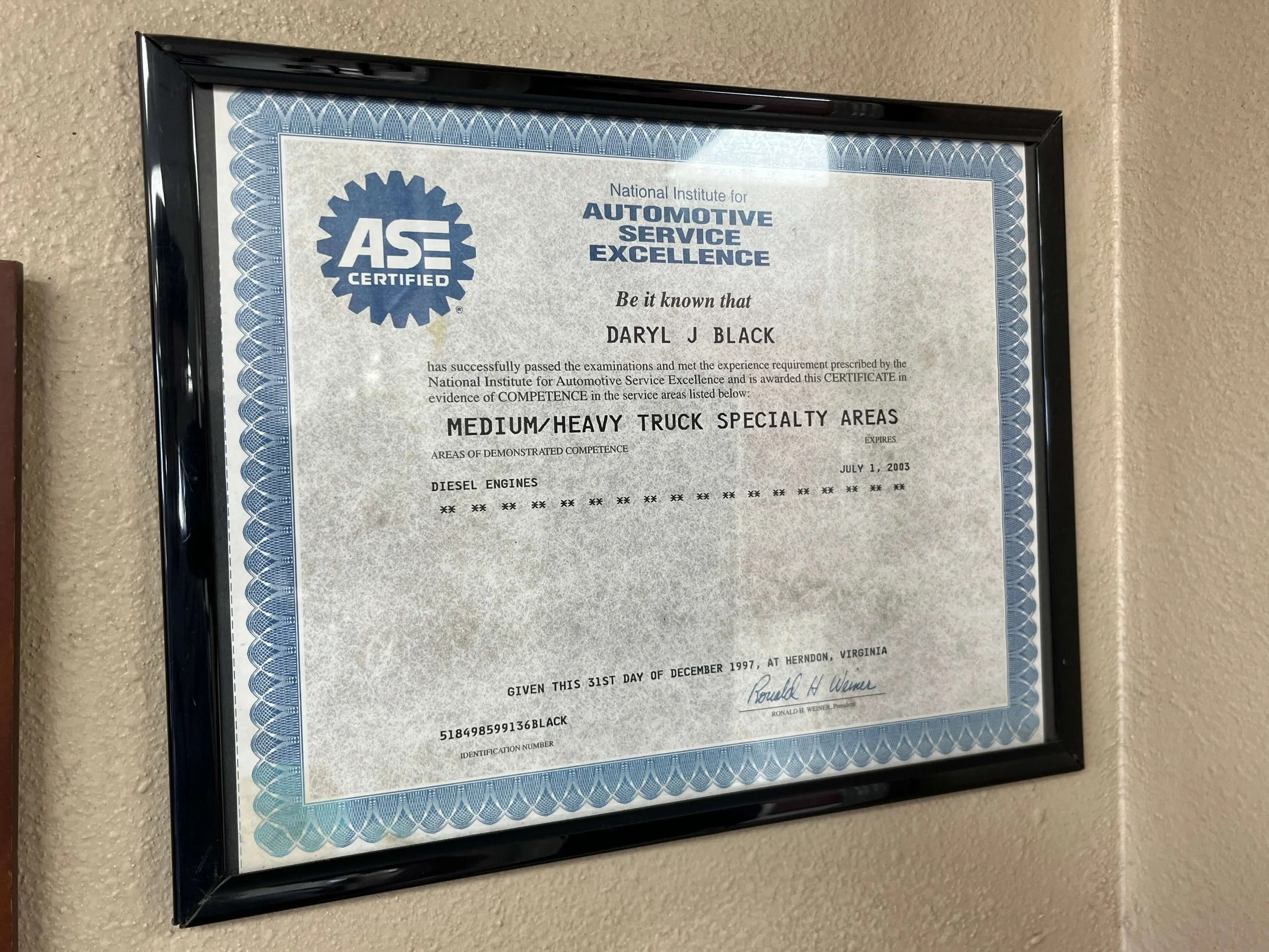 Framed ASE certification for medium/heavy truck specialty areas with a blue border.