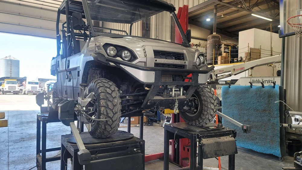 Side-by-side UTV up on the alignment rack at Itty Bitty Equipment Co. in Richmond, Utah