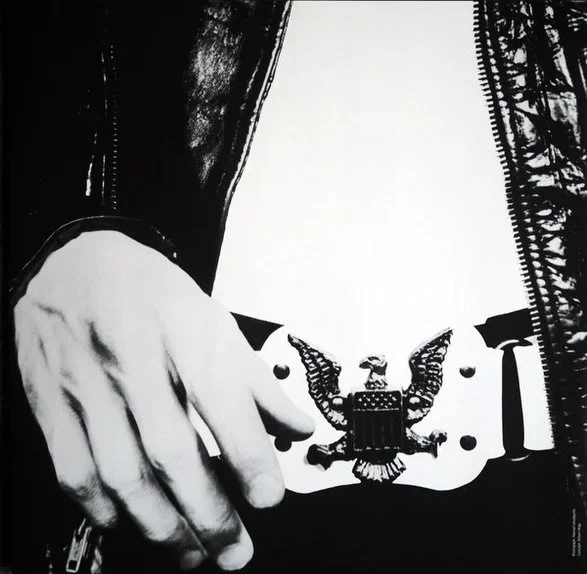 1960/1970s Saddle Belt famously known for being reused for the iconography of the RAMONES.

This one is tagged a LARGE, but can be re-punched for a smaller size. Recommended as is at a 34-36 waist.