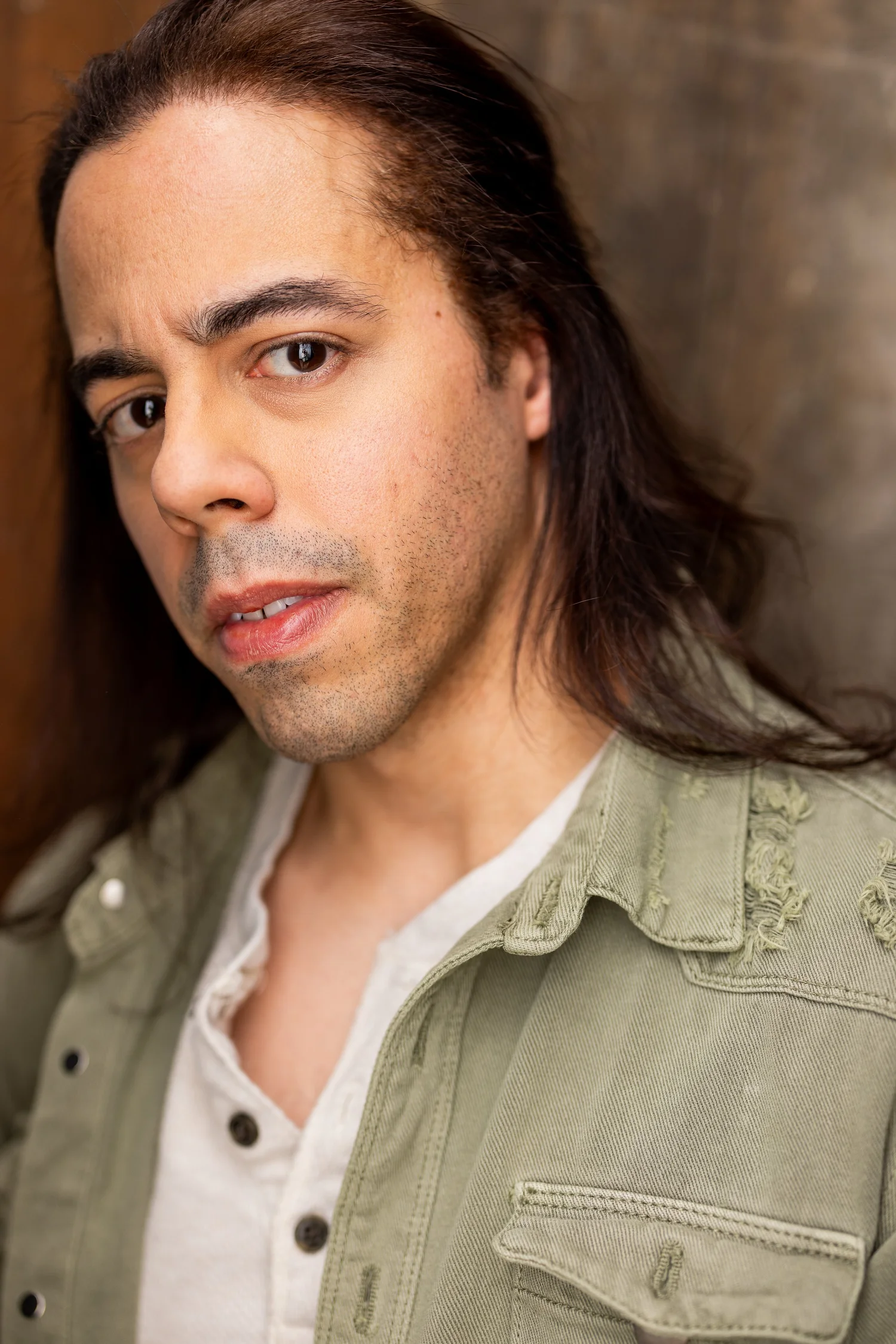 Francisco Marquez actor headshot in olive jacket