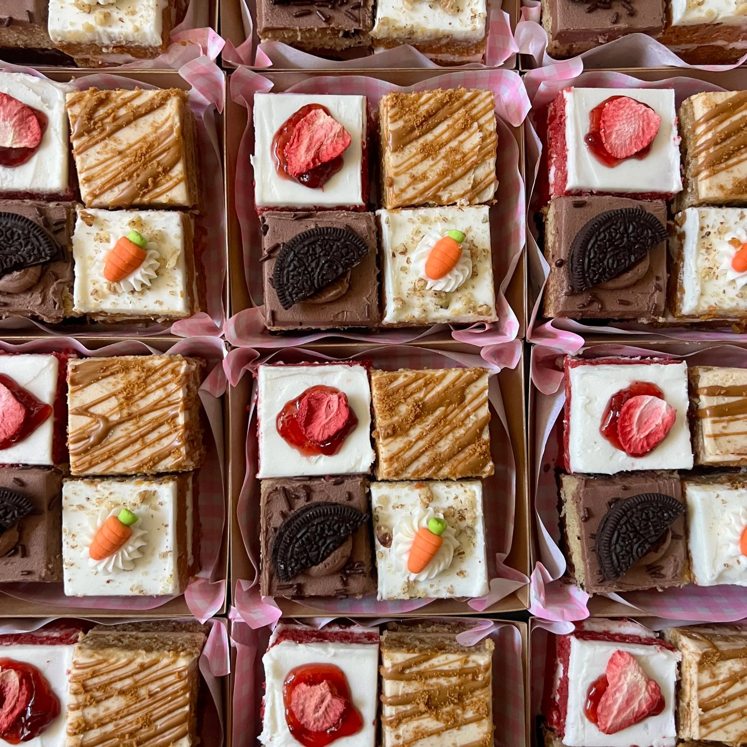 Pink container filled with mini cake desserts