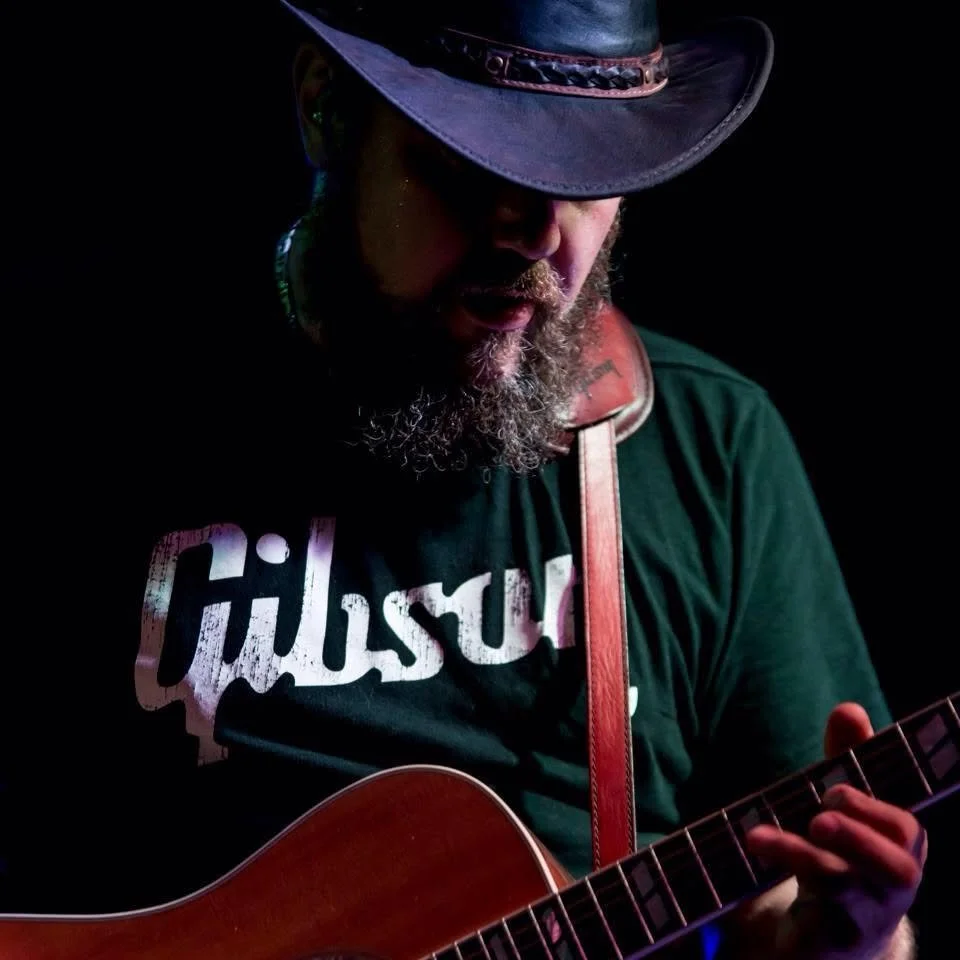 Drew playing Guitar