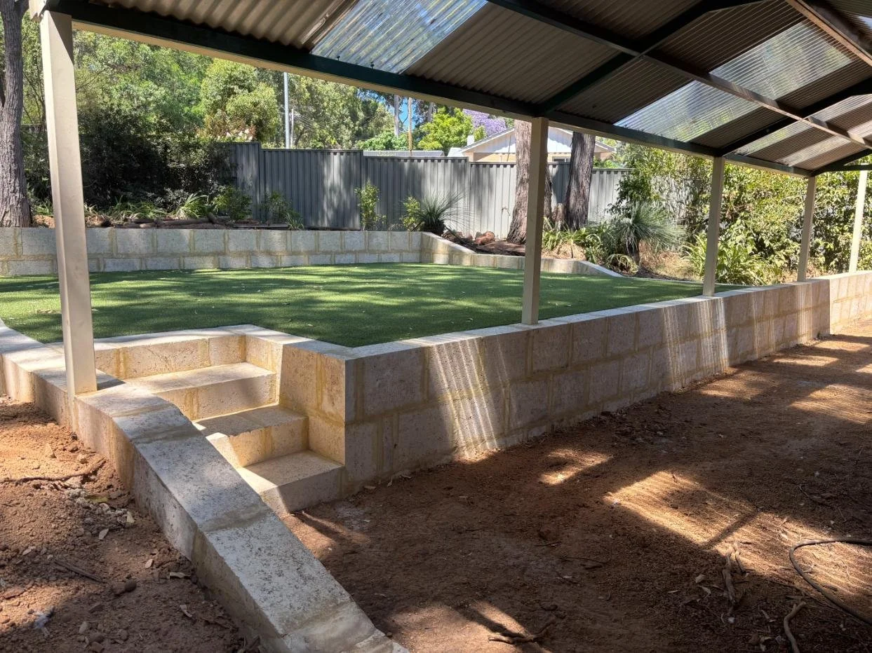 Retaining wall, limestone blocks, steps, artificial lawn