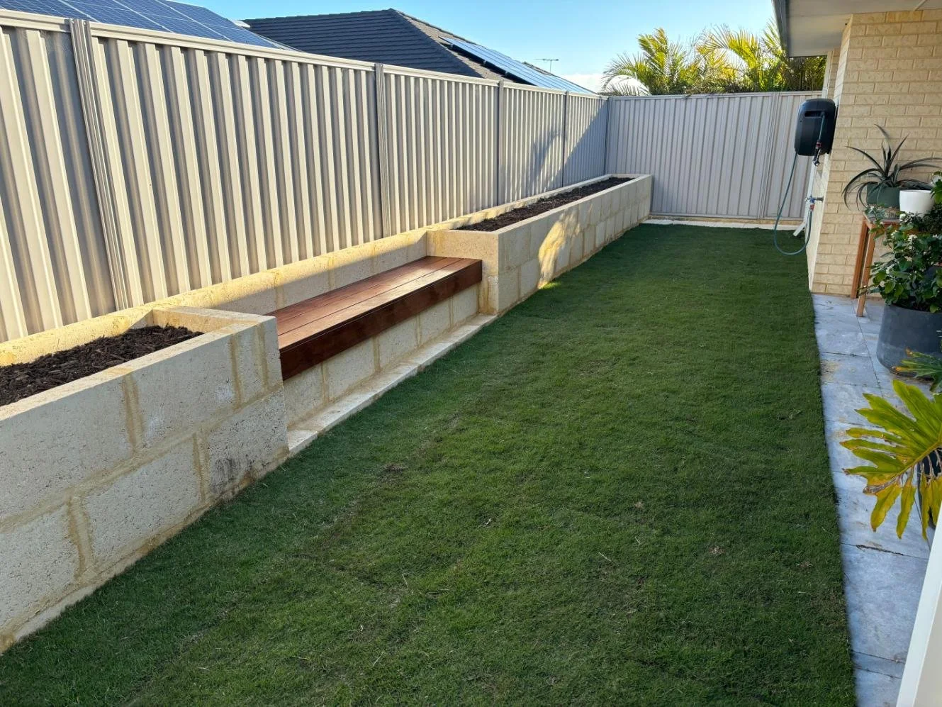 Natural lawn, raised garden bed, bench seat