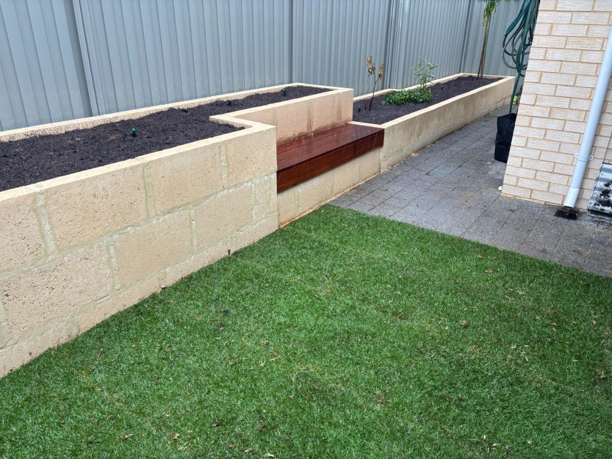 Raised garden, bench seat, natural lawn, reticulation