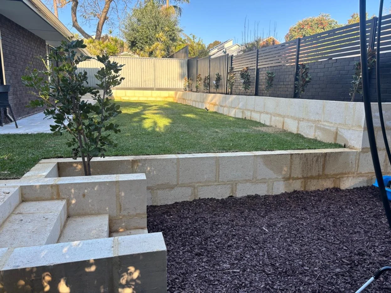 outdoor transformation, retaining, natural lawn, bluestone steppers, garden