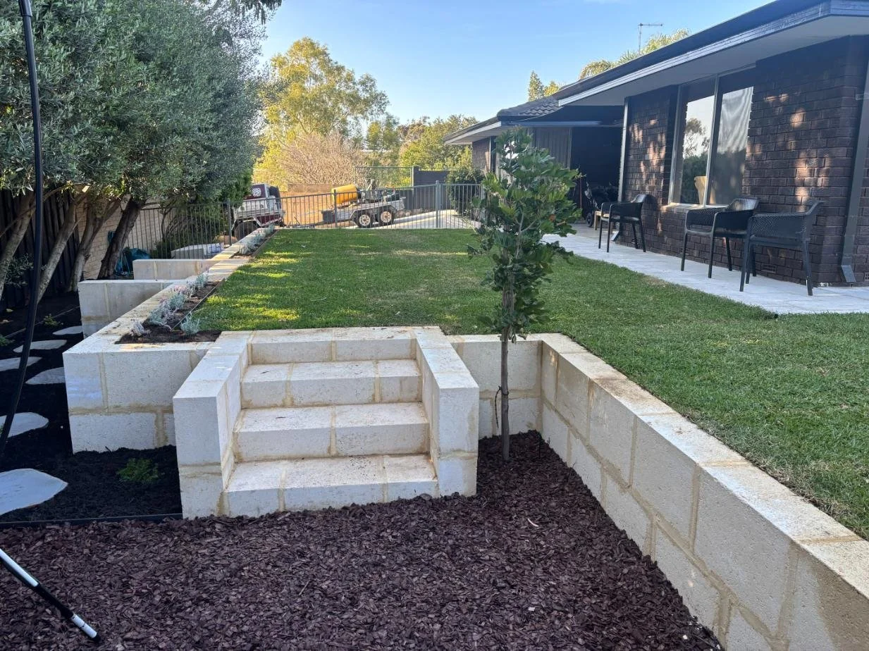 outdoor transformation, retaining, natural lawn, bluestone steppers, garden
