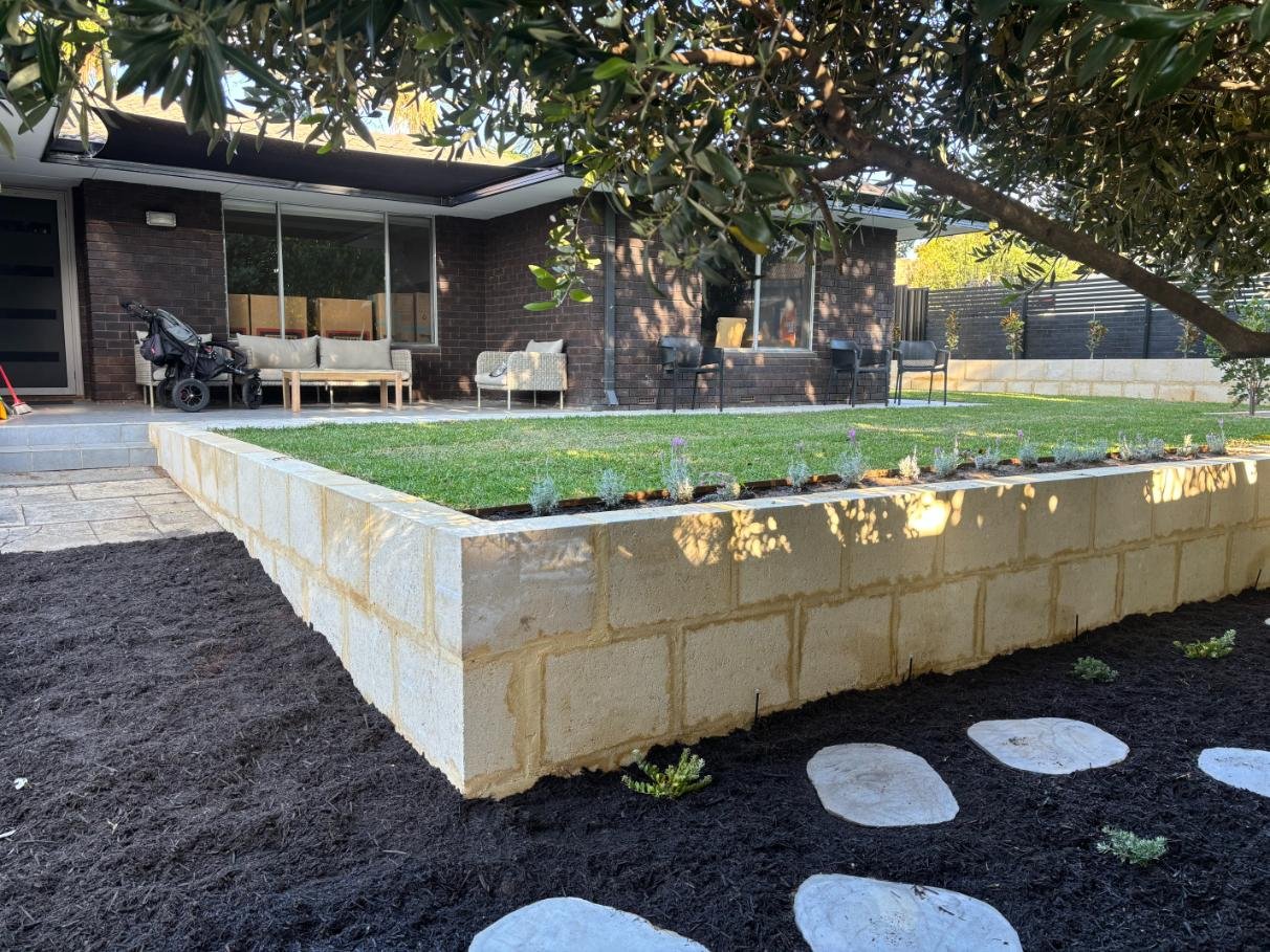 outdoor transformation, retaining, natural lawn, bluestone steppers, garden