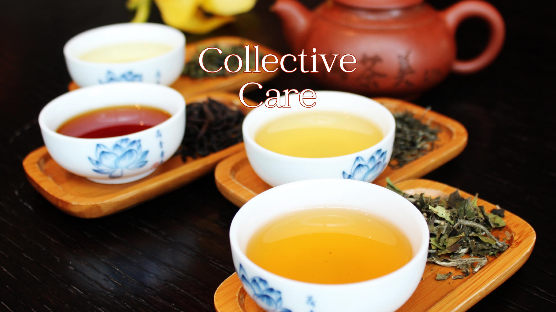 Four cups of tea with dried herbs on bamboo trays and a teapot in the background on a dark wooden surface.