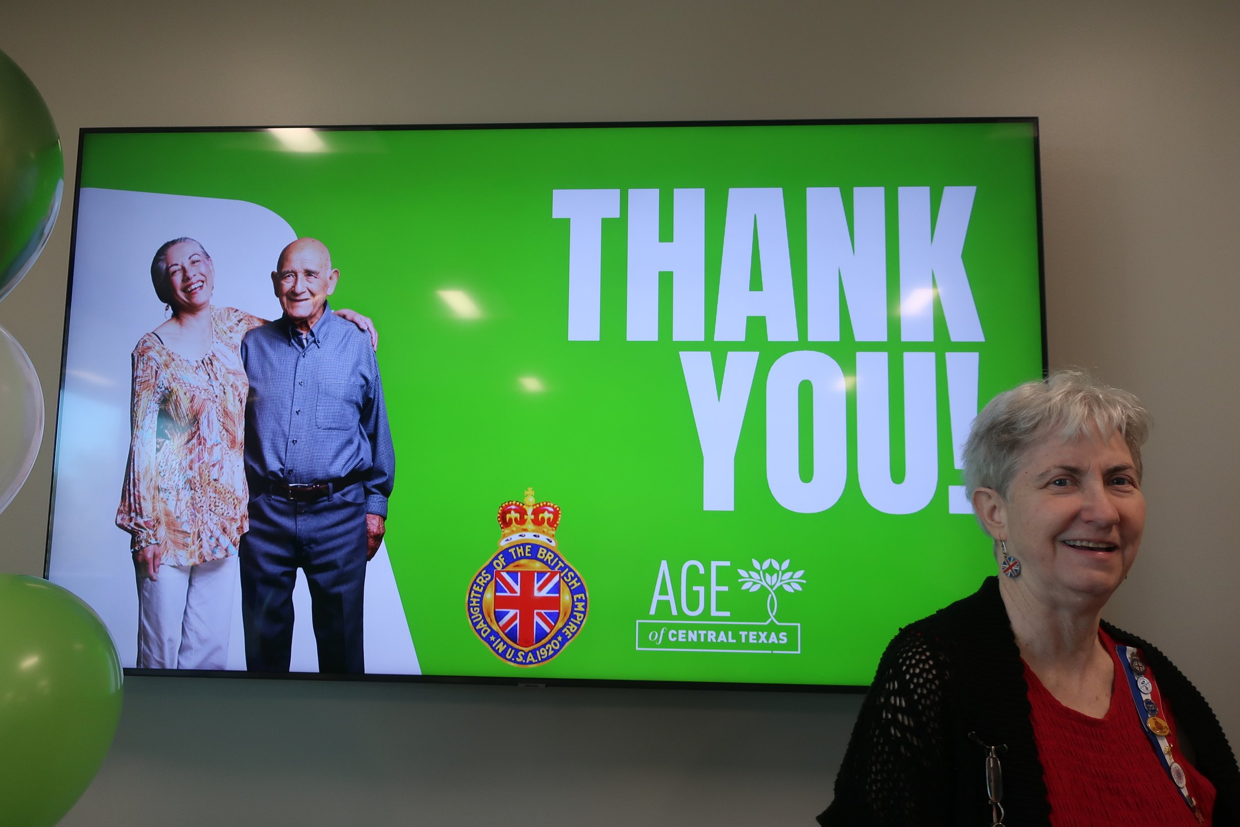  donating the MBH money to AGE of Central Texas - showing their logo and our DBE badge 