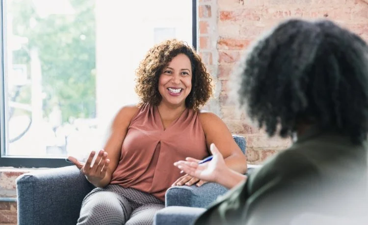 A female patient in chair discussing treatment-resistant depression therapy near Las Vegas, Nevada.