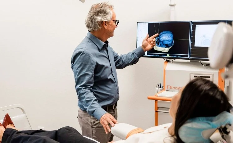 A woman doing TMS therapy, one of our Las Vegas psychiatric services for TRICARE patients.
