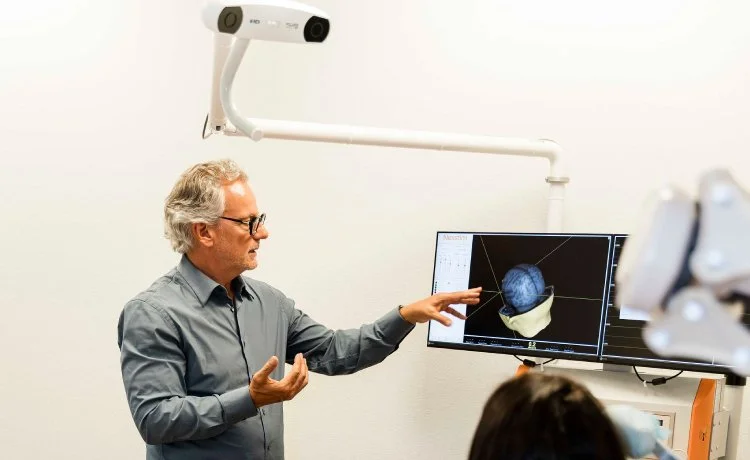 Dr. John Reitano discussing a brain scan with a patient during major depressive disorder treatment near Historic Westside, Las Vegas, Nevada.
