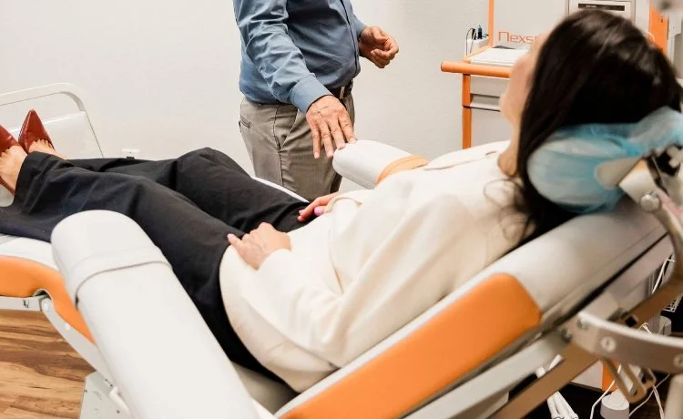 A female patient getting ready for a TMS therapy session, part of her Summit Hills, Las Vegas panic disorder therapy.