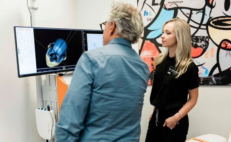 Dr. Reitano and TMS technician evaluating brain imaging as part of mood disorder therapy near Sunrise Manor, Nevada.