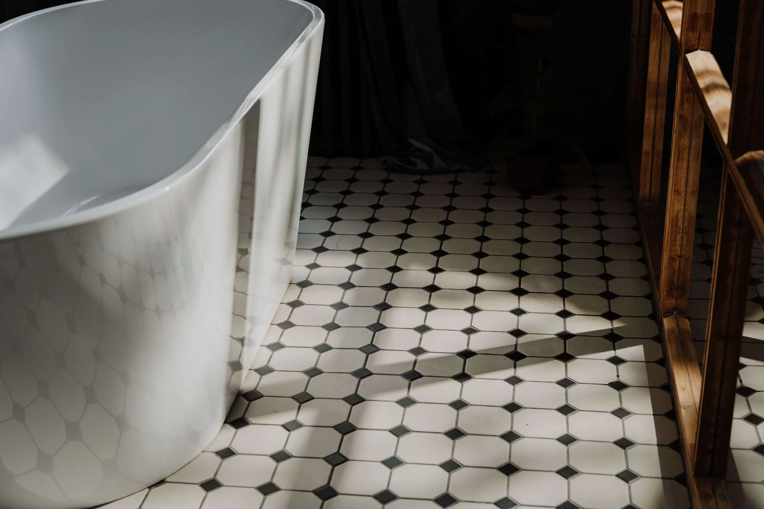 high end bathroom with black and white tile