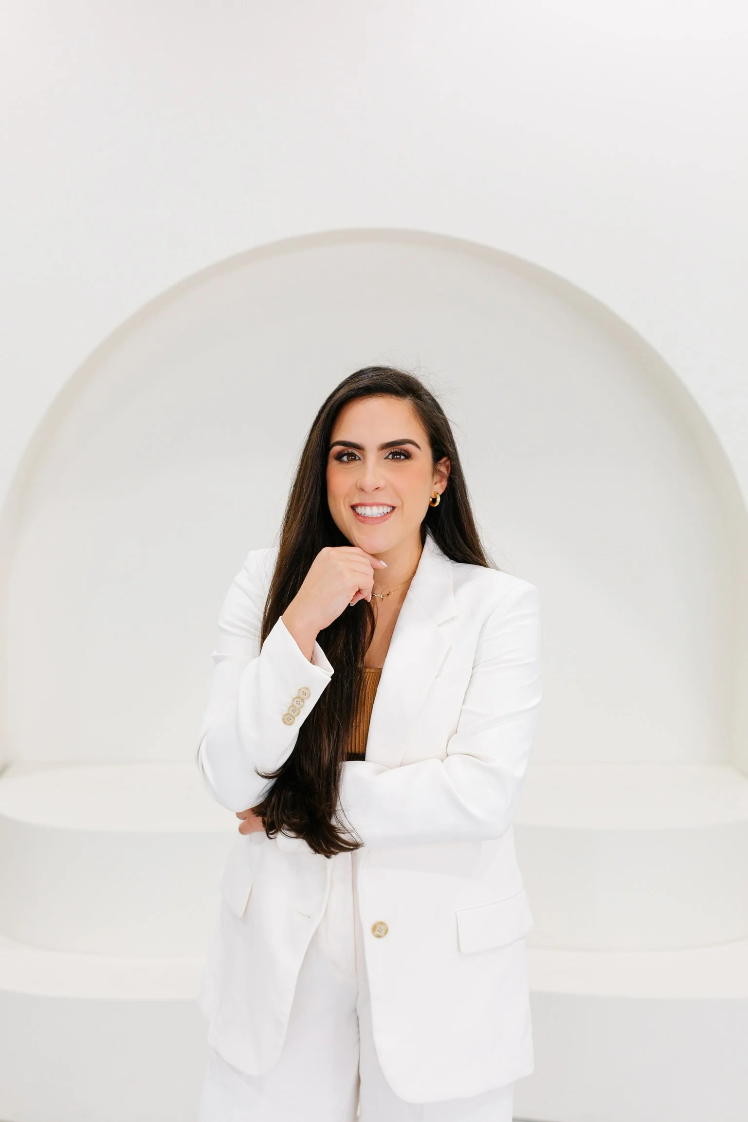 Dr. Haneen Shehadeh smiling at her dental practice in Fort Lauderdale