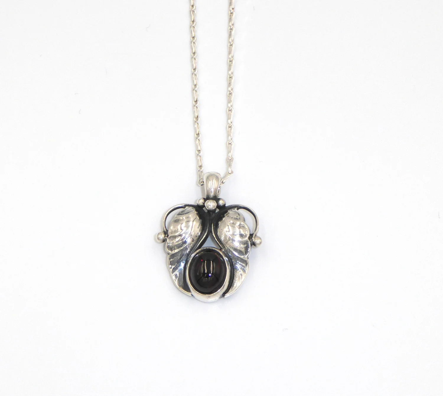 A vintage, Art Nouveau style, silver and garnet 