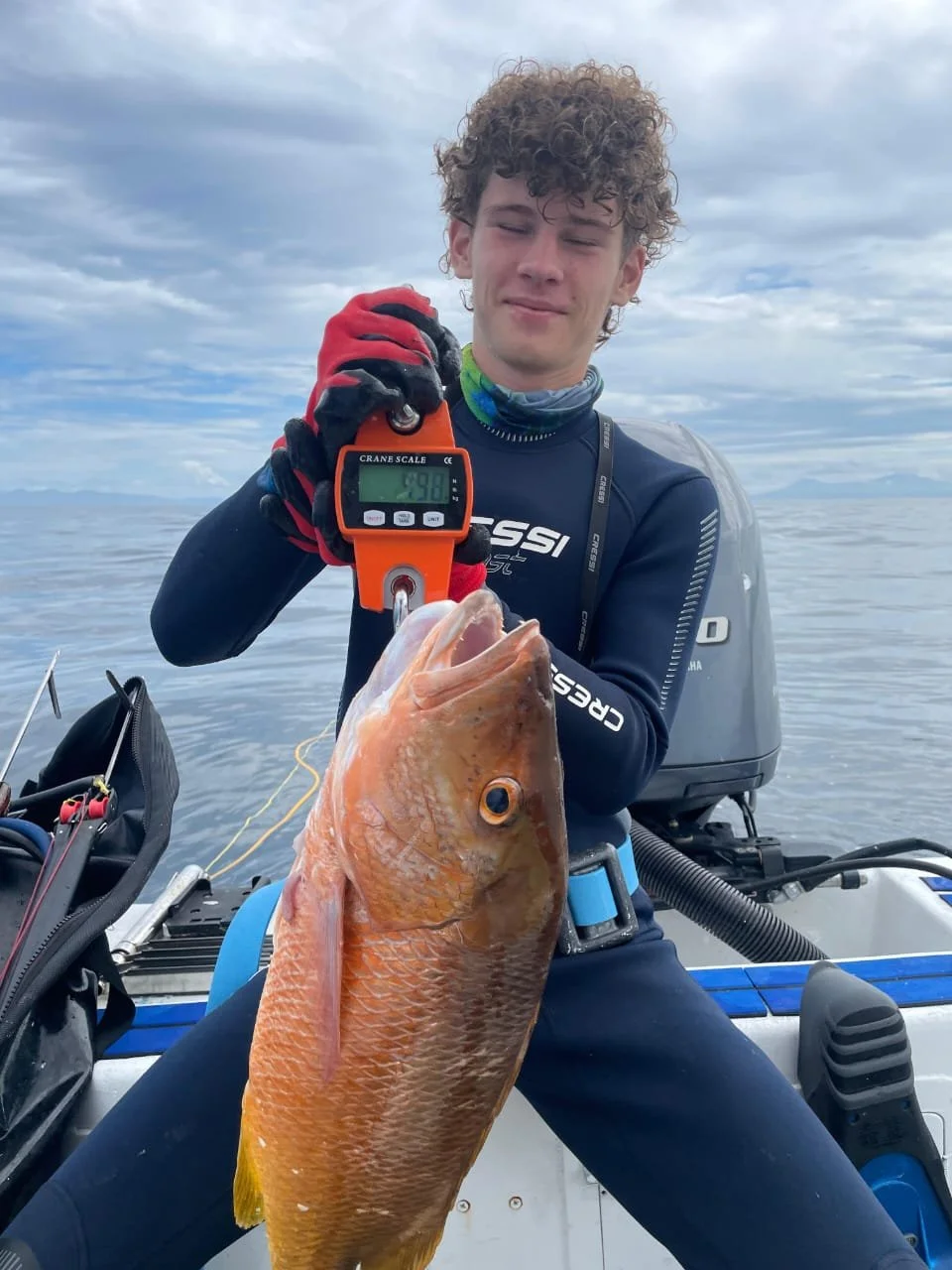 Altum Spearfishing guide after on an open spearfishing tour in Flamingo Bay, Costa Rica holding a freshly caught Yellowtail snapper. Private Reef Charter, Blue Water, Tuna, Grouper, Mackerel, Trevally, Snapper, Pompano, Potrero, Tamarindo