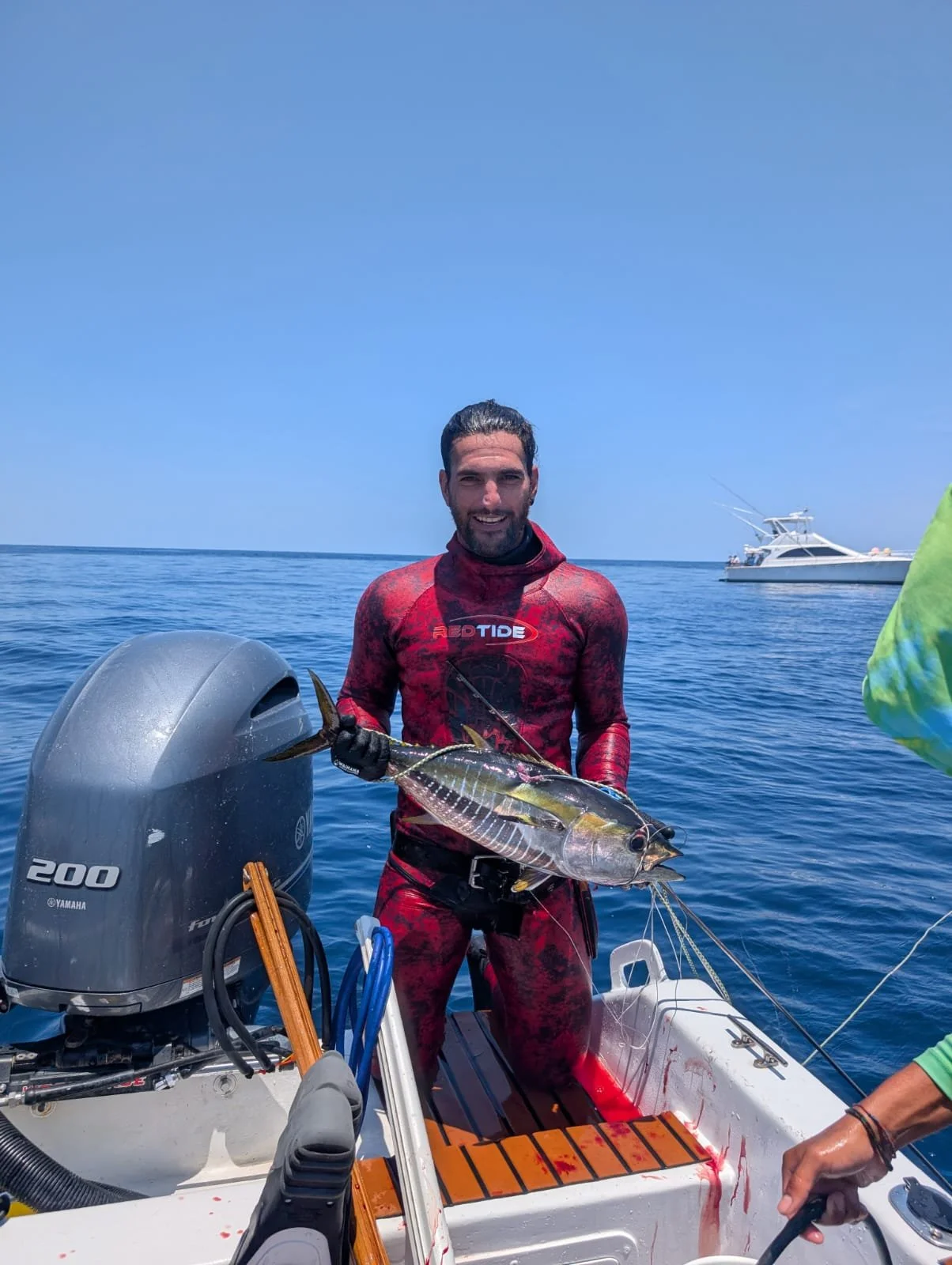 Altum Spearfisher on a Private Blue Water Charter in Flamingo Bay, Costa Rica holding a freshly caught bluefin tuna. Reef Charter also available, Tuna, Grouper, Wahoo, Trevally, Snapper, Pompano, Potrero, Tamarindo