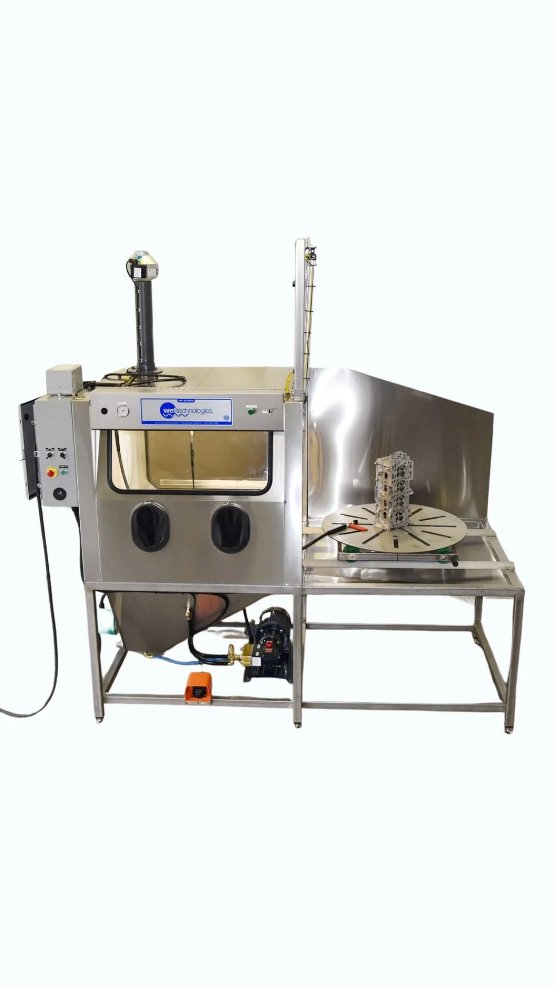 A manual stainless steel Wet Technologies vapor blasting system