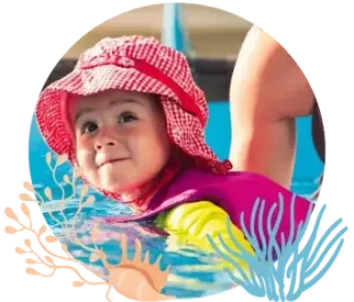A young child in a swimming pool wearing a pink sun hat and a colorful swimsuit, with water and decorative plant graphics around the edges.