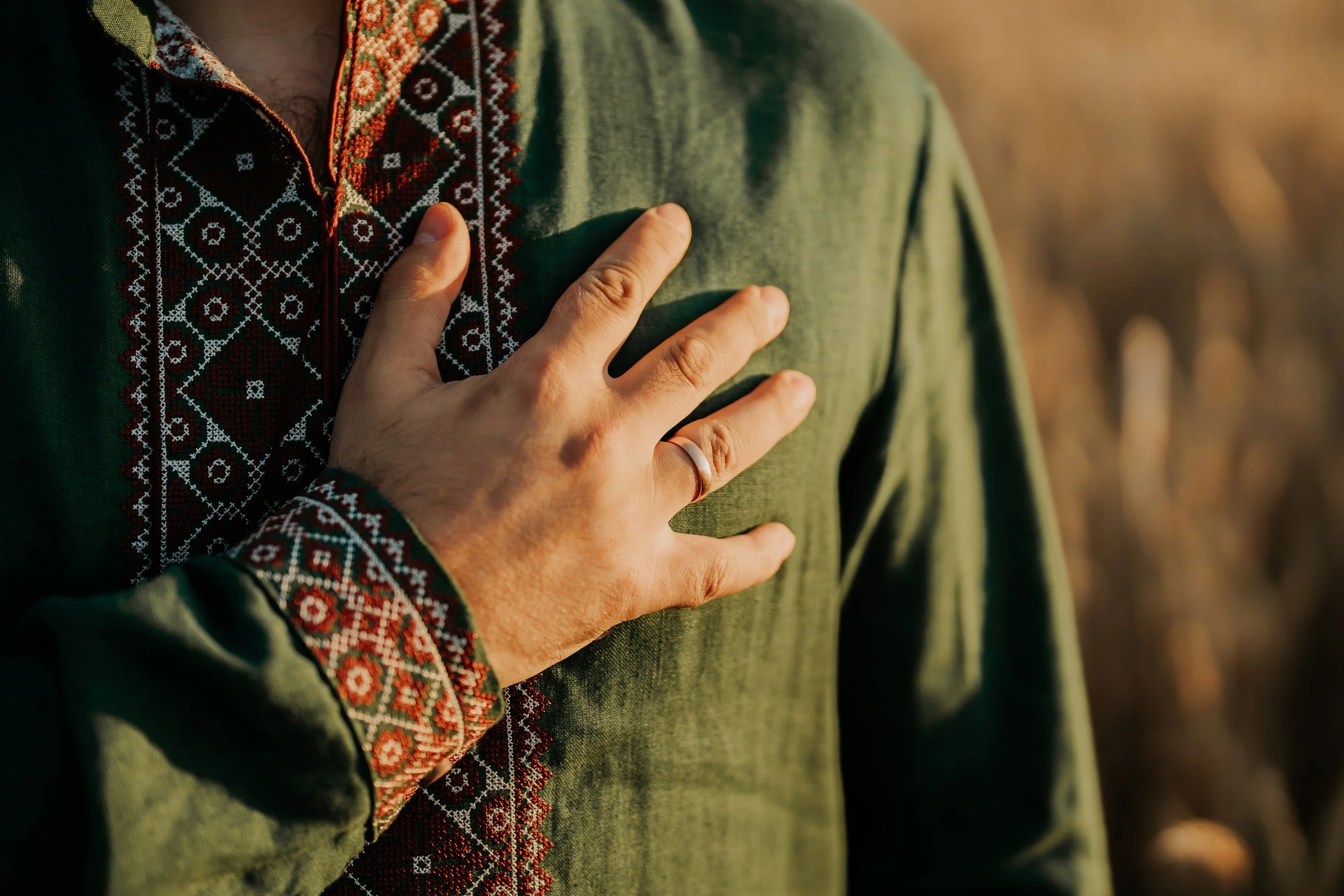 Person with hand on chest representing heart health and the cardiovascular benefits of sunlight exposure.