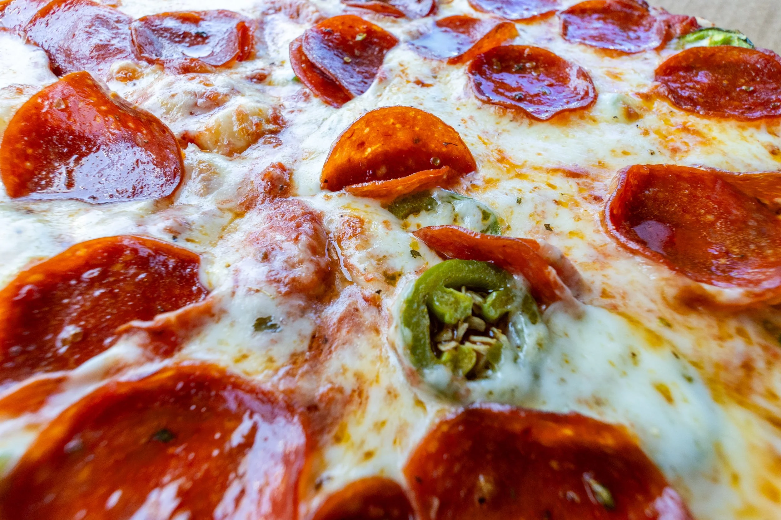 Pepperoni and jalapeño pizza at Arizona Pizza Company in Vail Arizona
