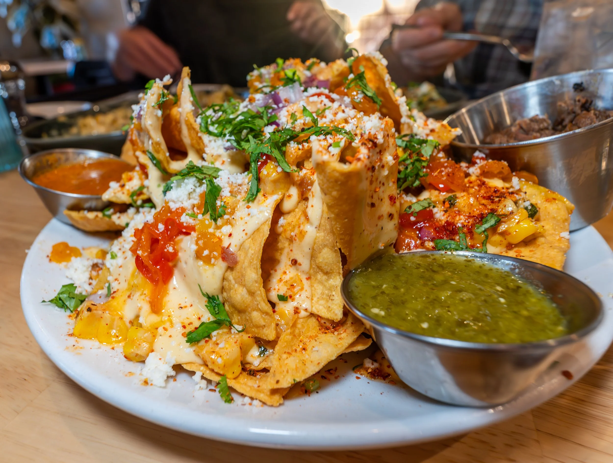 Elote nachos from Redbird Scratch Kitchen in Casas Adobes Tucson Arizona with corn, cheese, and Southwest toppings.