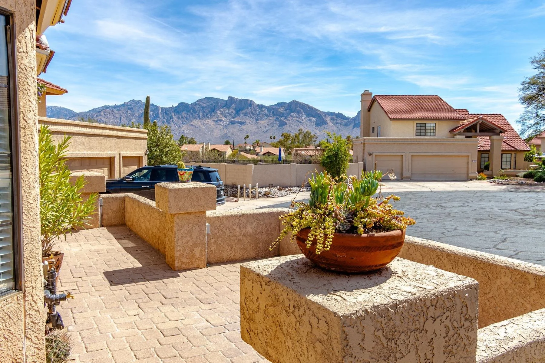 Paver front patio overlooking an Oro Valley neighborhood with Catalina Mountain views.