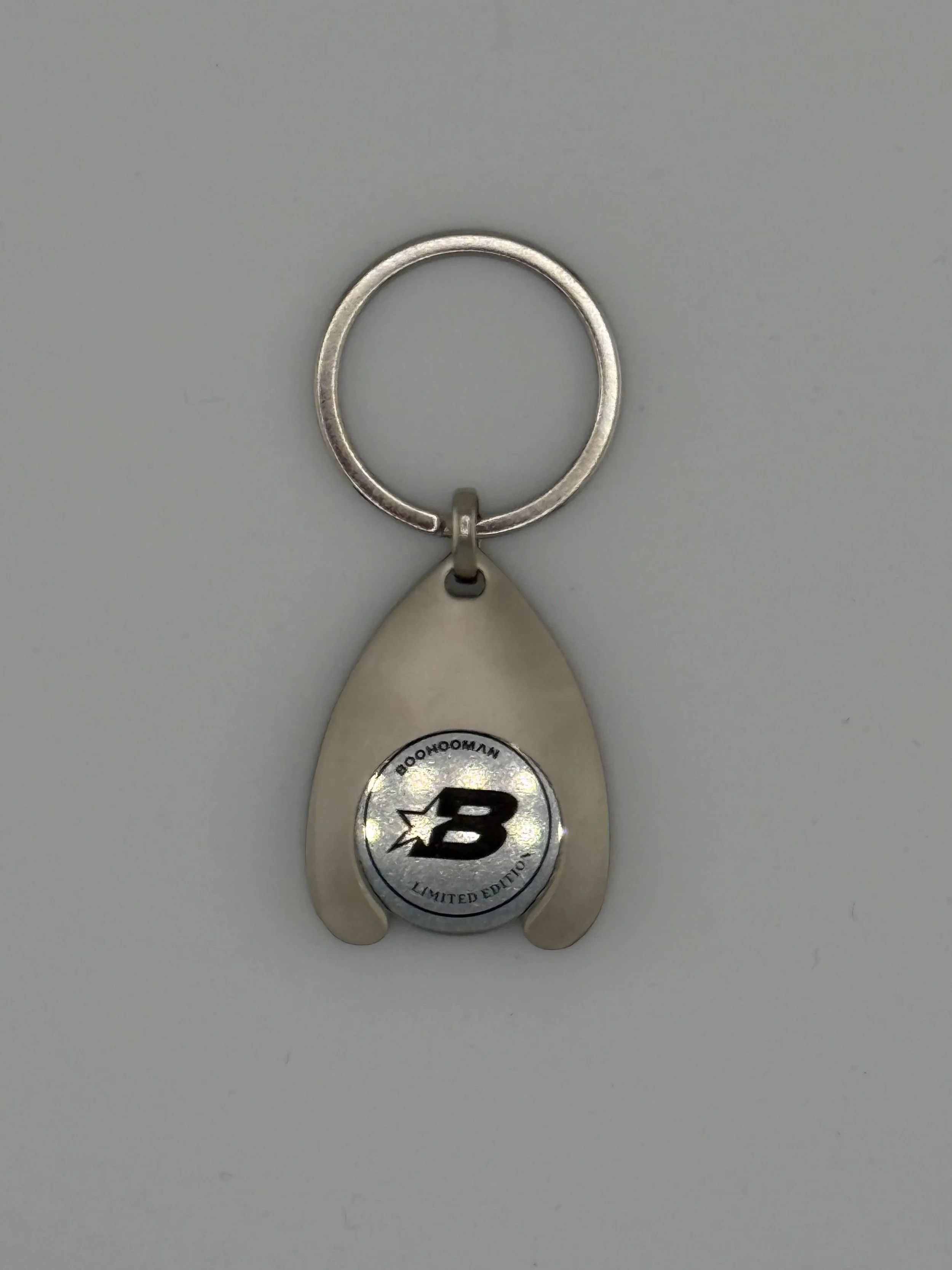 For BoohooMAN we created limited-edition metal keyrings with a custom die-struck medallion showcasing their “M” and “B” star logos. The brushed metal finish and compact shape deliver a retail-quality feel, turning a simple keyring into a collectible 
