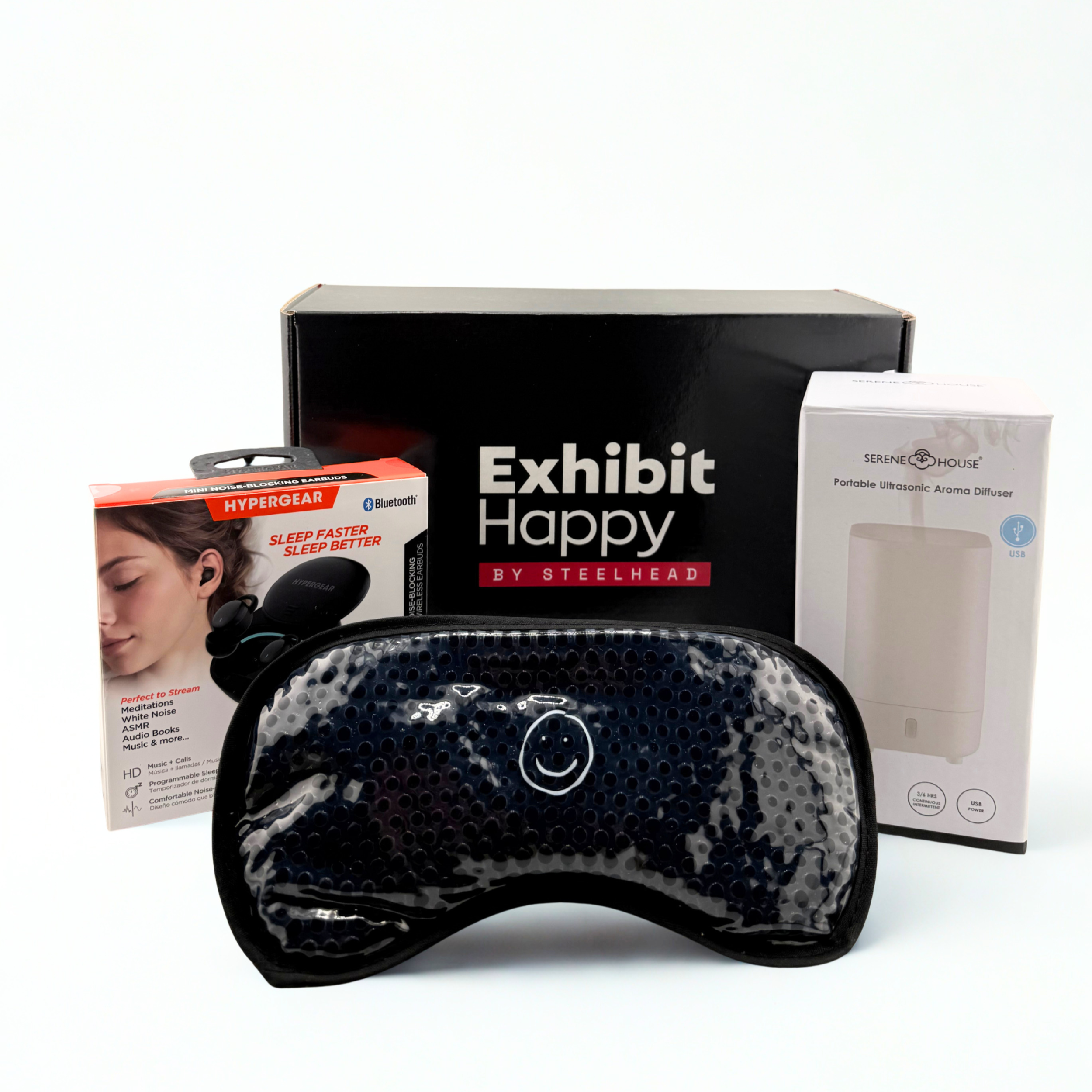Custom curated corporate gift kit designed for Exhibit Happy by Steelhead trade show exhibitors and event teams in Las Vegas. This premium branded merchandise box includes wireless sleep earbuds, an aroma diffuser, and a cooling eye mask—creating a h