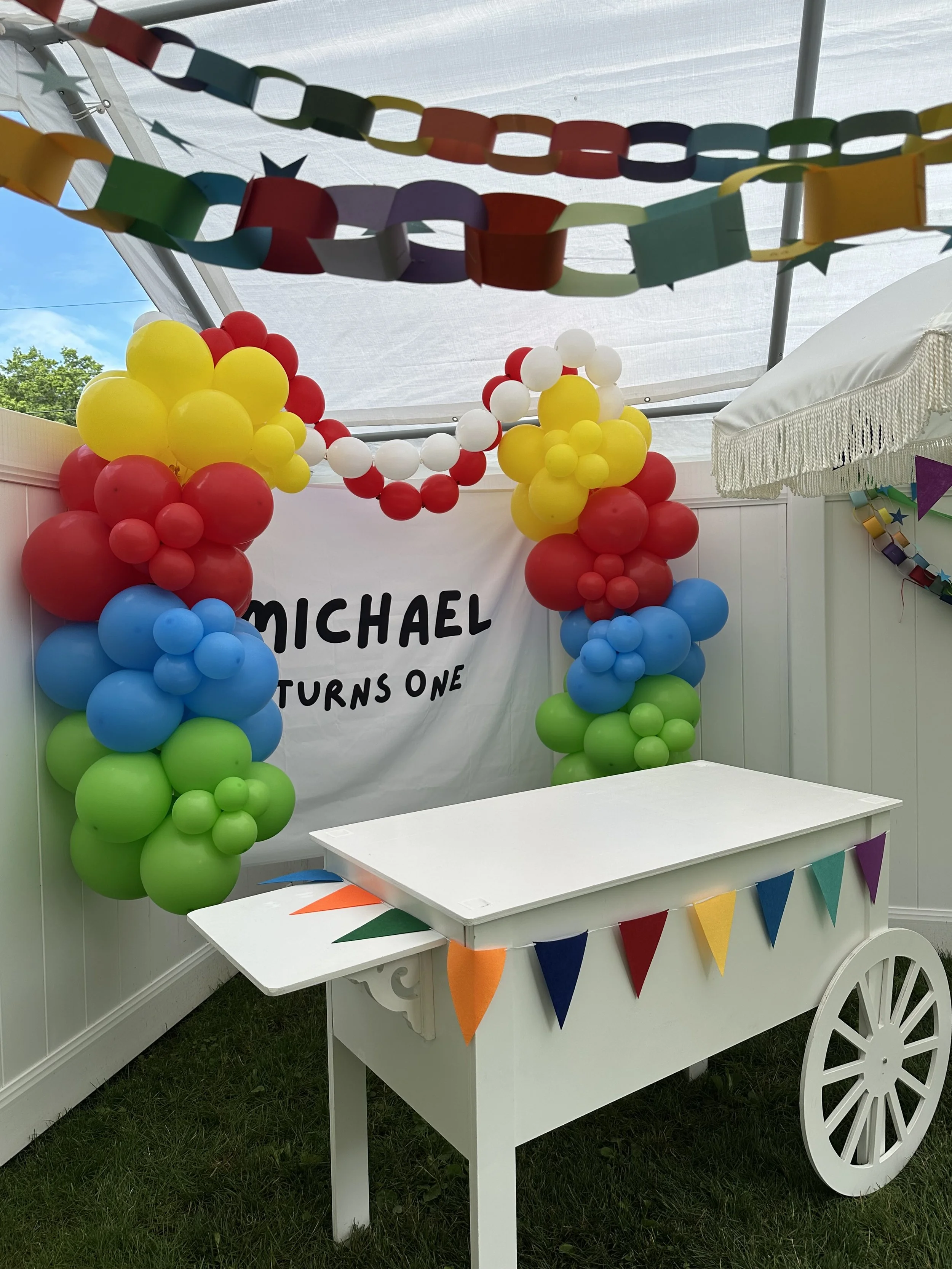 wood cart with streamers balloons.jpeg