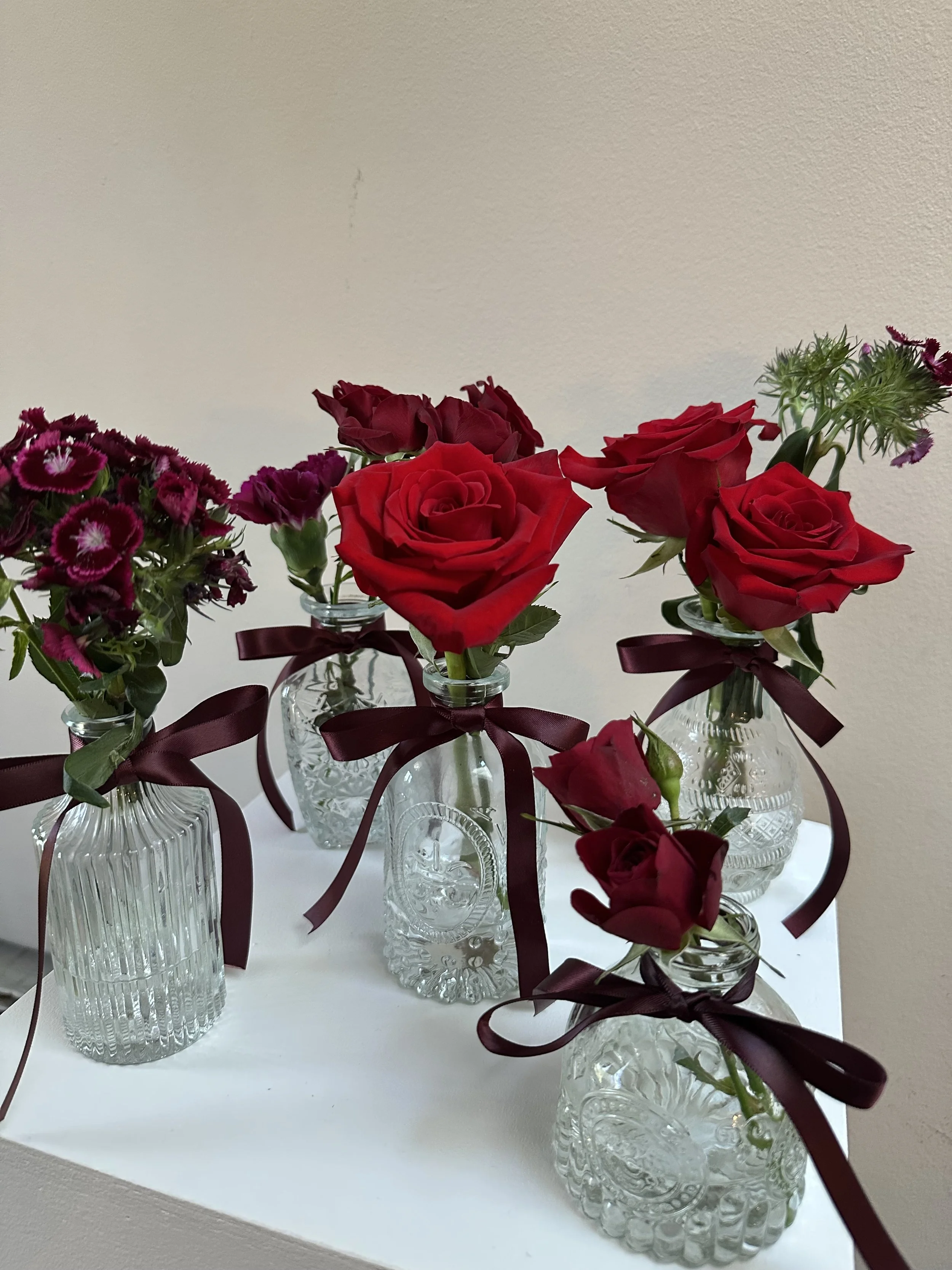 red roses bud vases.jpeg